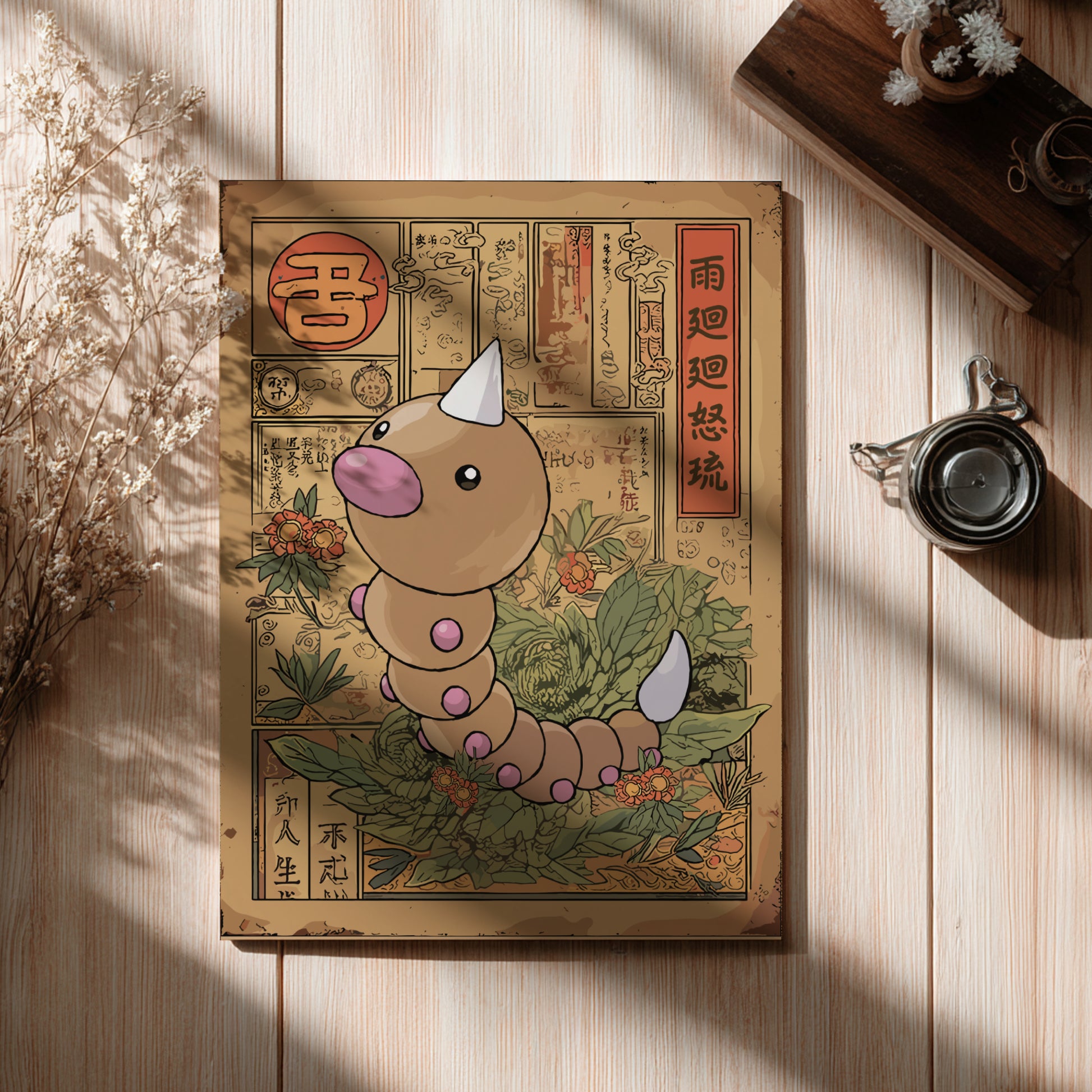 Illustrated Weedle Pokemon on a decorative box with Chinese characters on a wooden surface