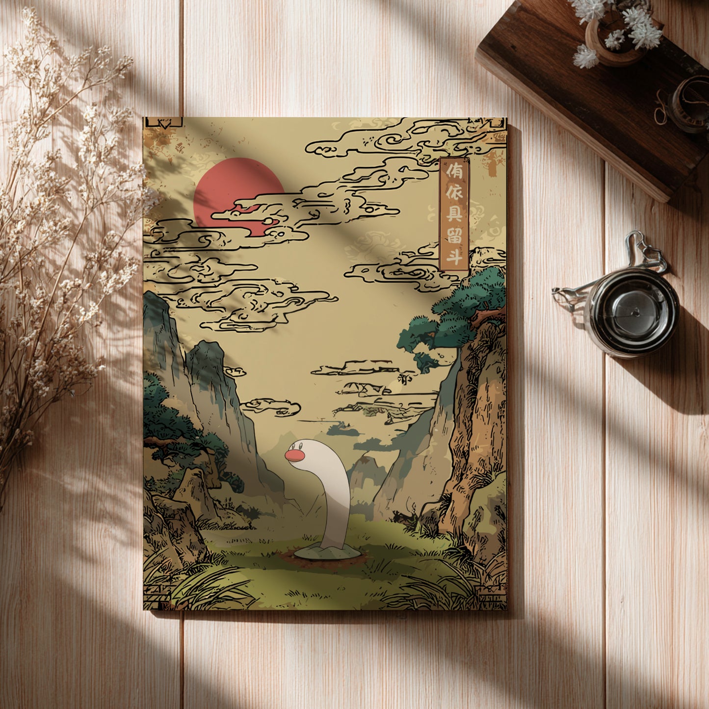 Decorative poster with a stylized landscape design featuring Wiglett Pokemon, mountains, and a red sun on a wooden surface.
