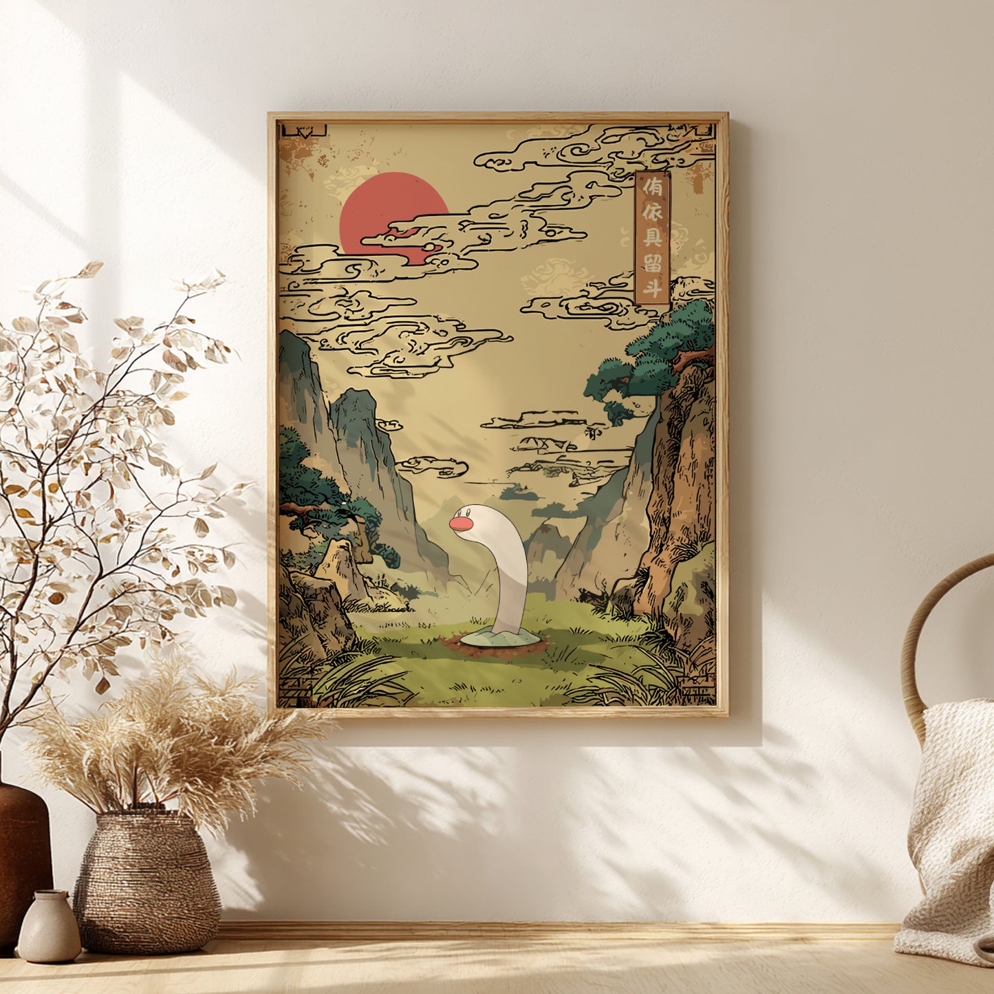 Framed artwork of Wiglett Pokemon and a stylized landscape with a red sun and green trees on a beige wall.