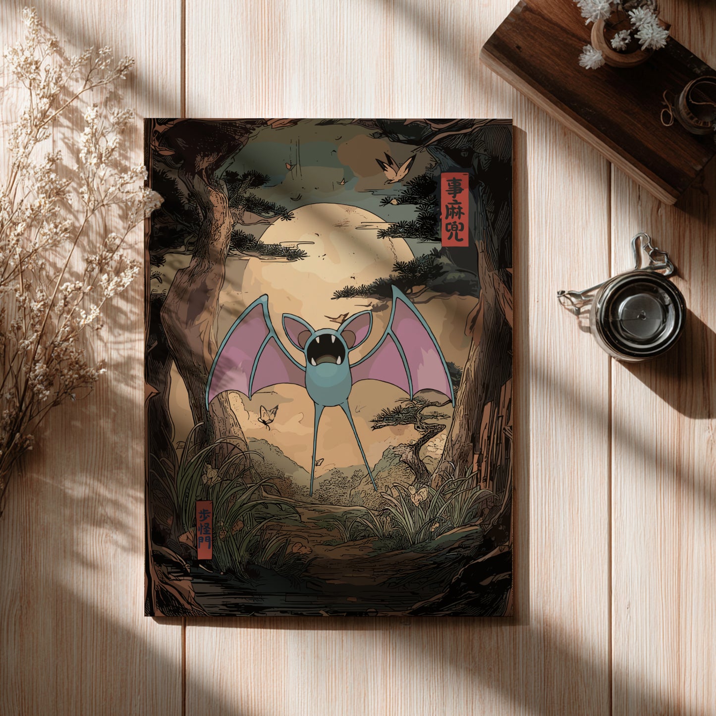 Book cover with Zubat Pokemon illustration on a wooden surface