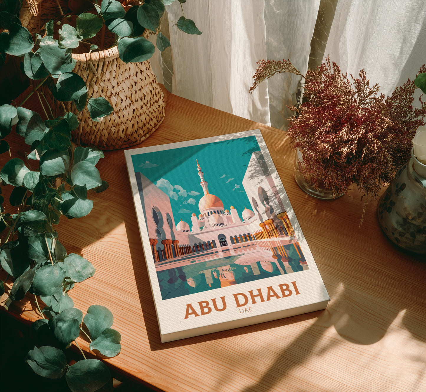 Canvas of 'Abu Dhabi' on a wooden table with plants around