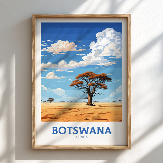 Framed artwork of a desert landscape with a tree, labeled 'Botswana Africa', on a white wall.
