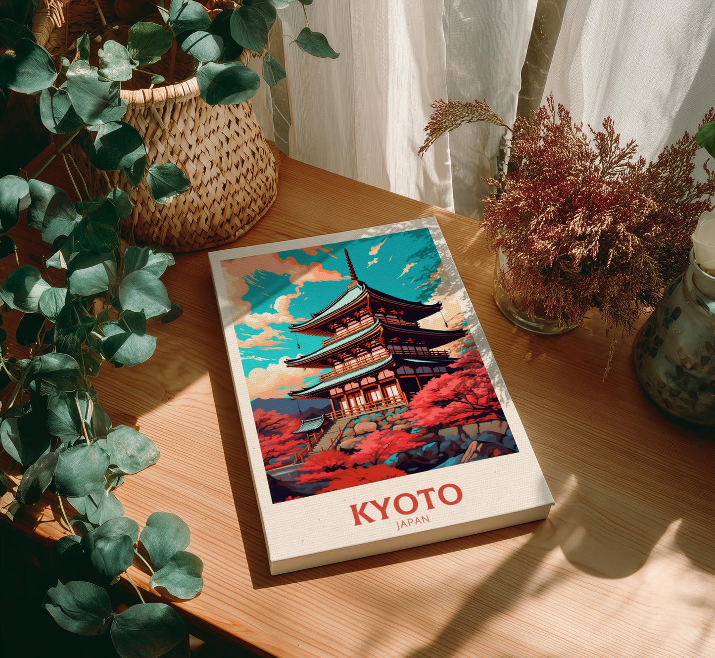 Canvas 'Kyoto' with a Japanese temple illustration on a wooden table with plants.