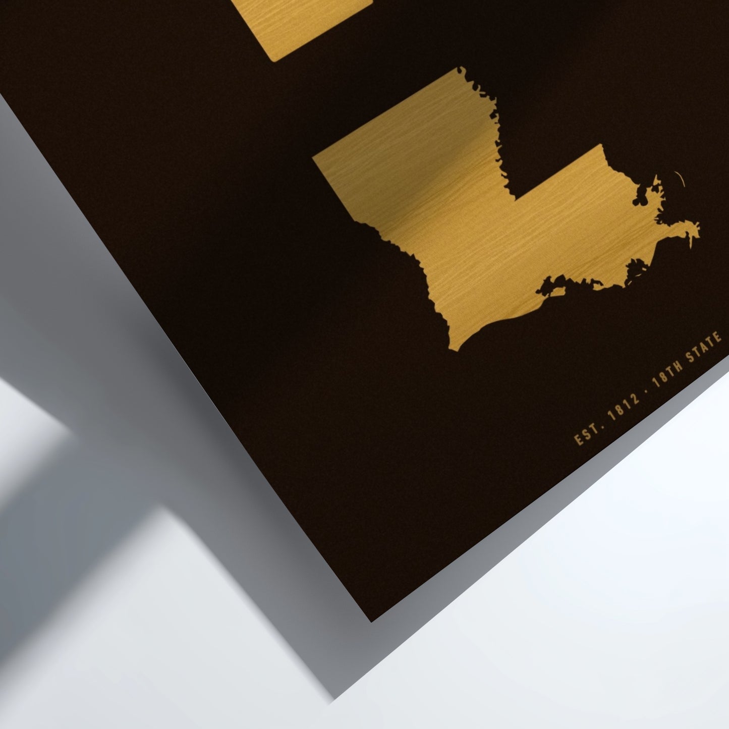 Gold map of Maine on a black background