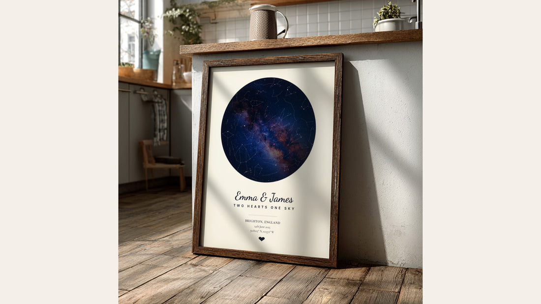 Navy star map poster with the Milky Way in a dark wood frame, leaning against a sunny kitchen counter