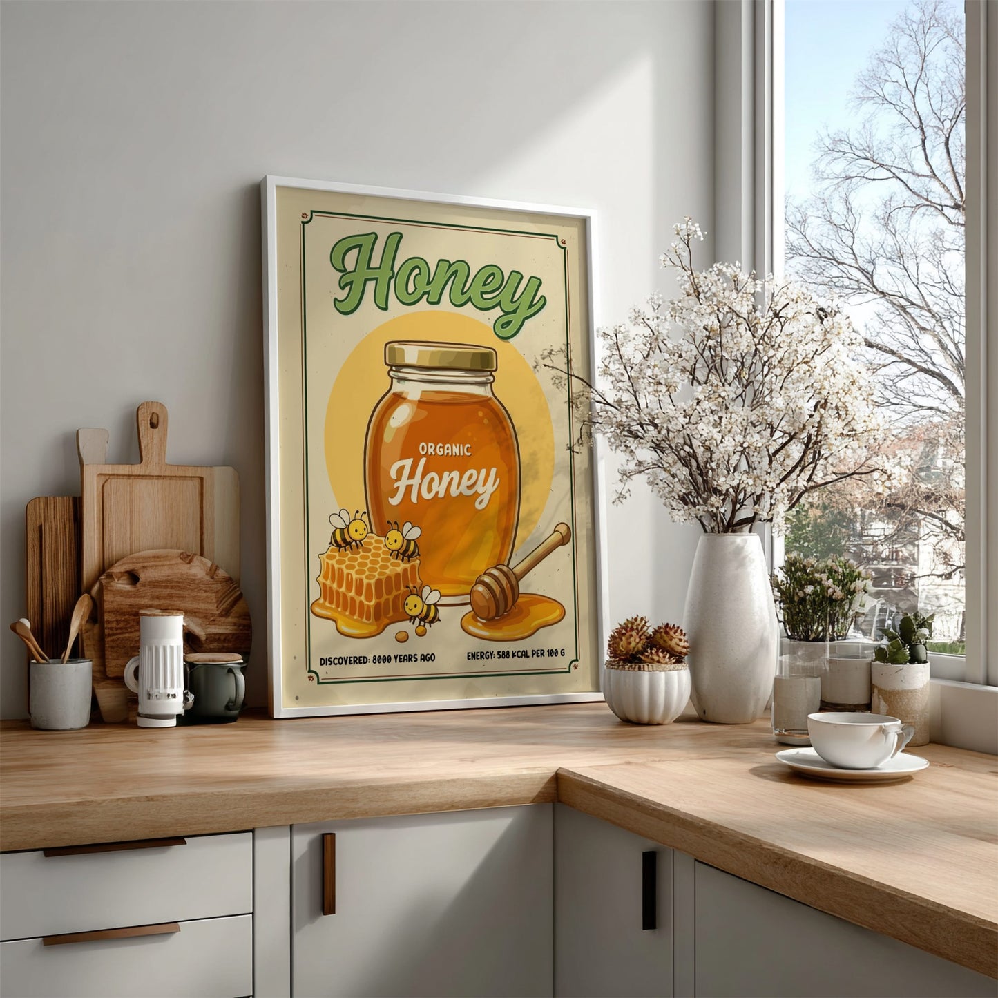 Kitchen counter with a 'Honey' themed poster, wooden cutting boards, and decorative items.