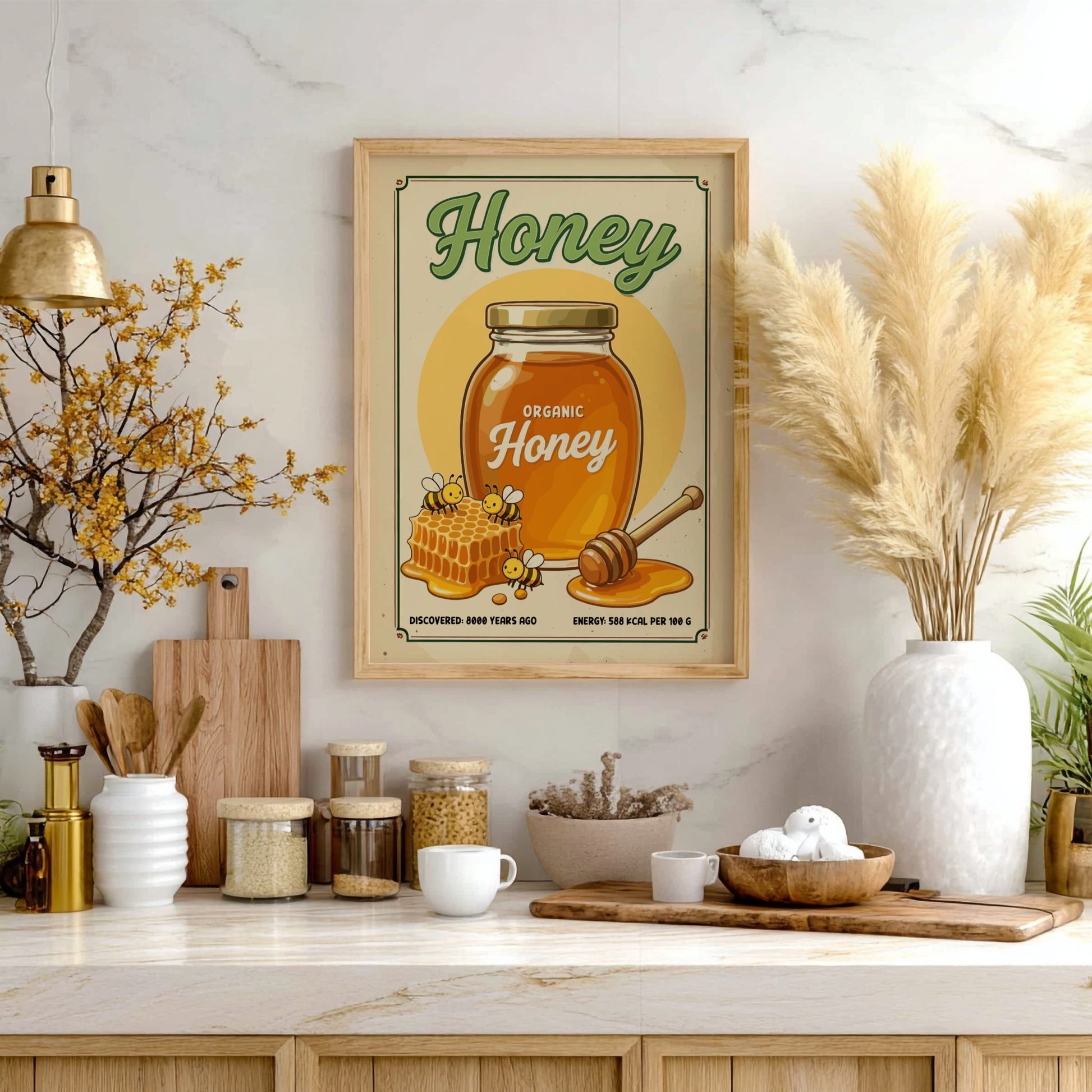 Framed honey poster on a kitchen counter with decorative items.