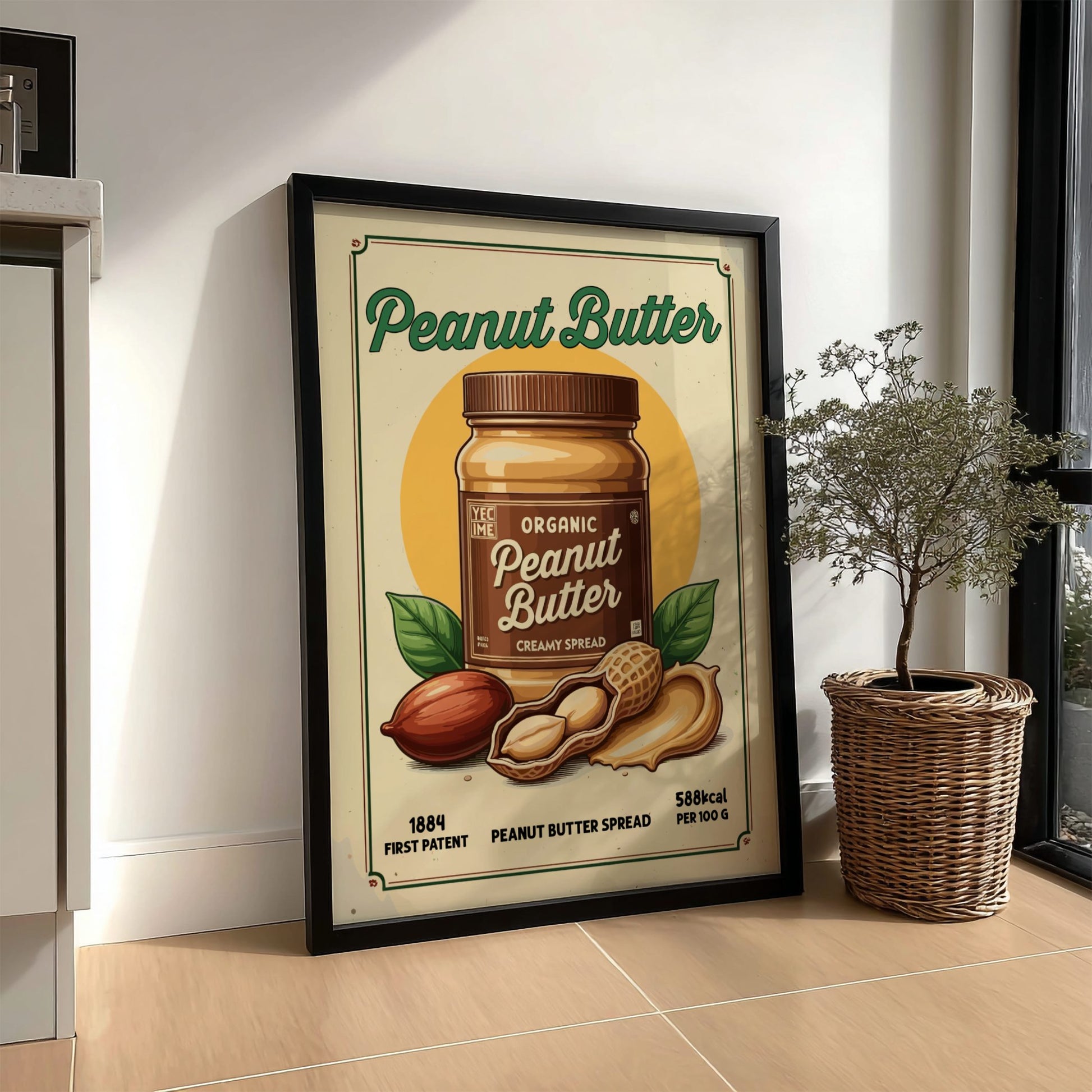 Framed poster of a peanut butter jar on a wall next to a plant