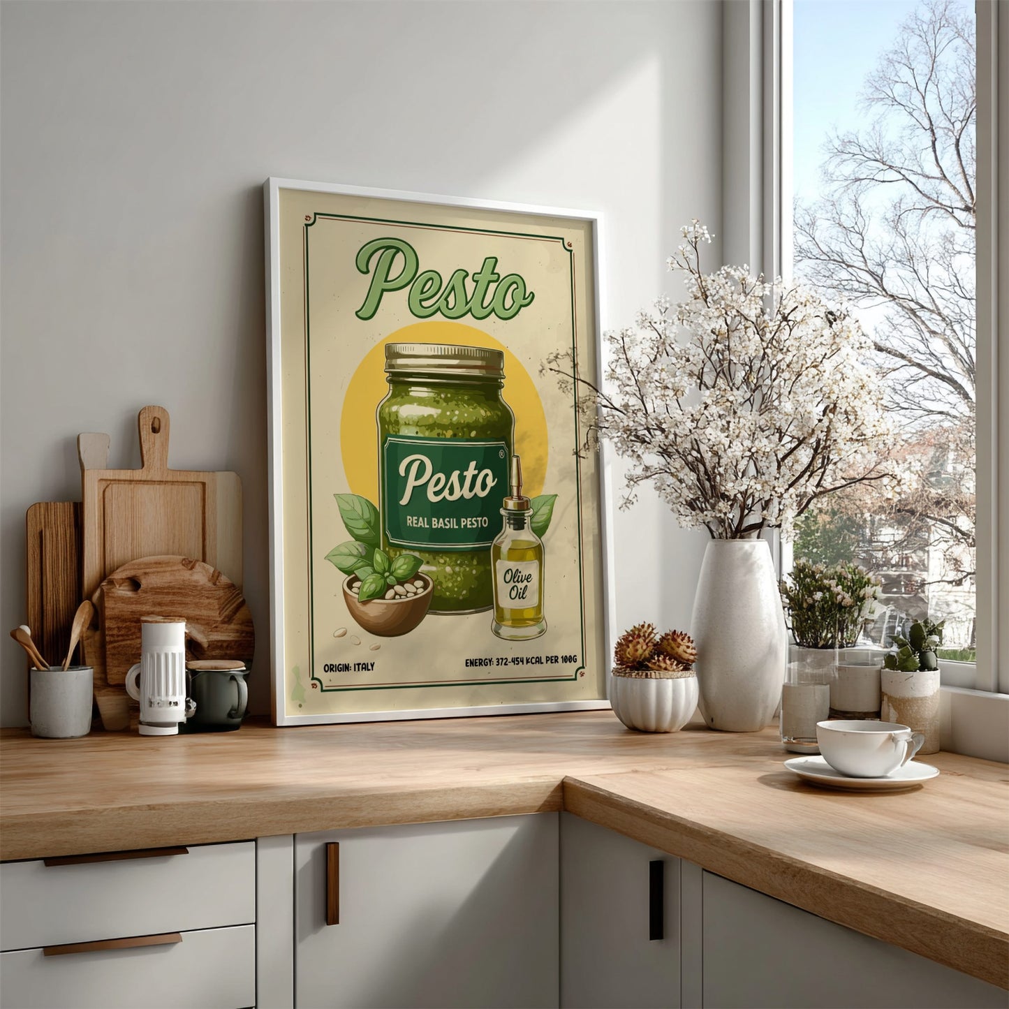 Kitchen counter with a 'Pesto' themed poster, wooden cutting boards, and decorative items.