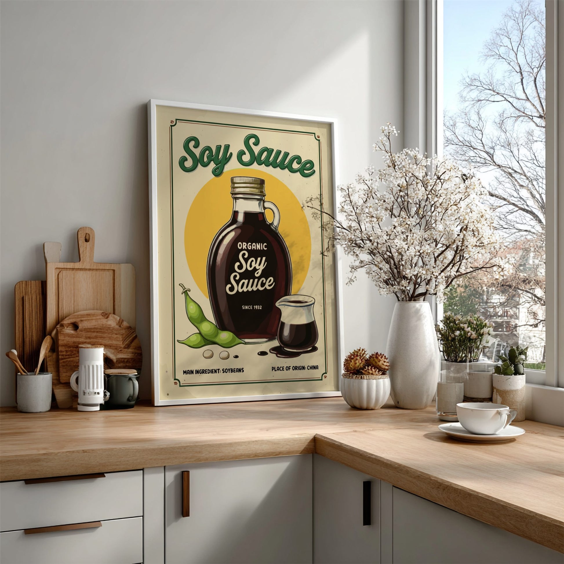 Kitchen counter with a soy sauce poster, wooden cutting boards, and a window view.