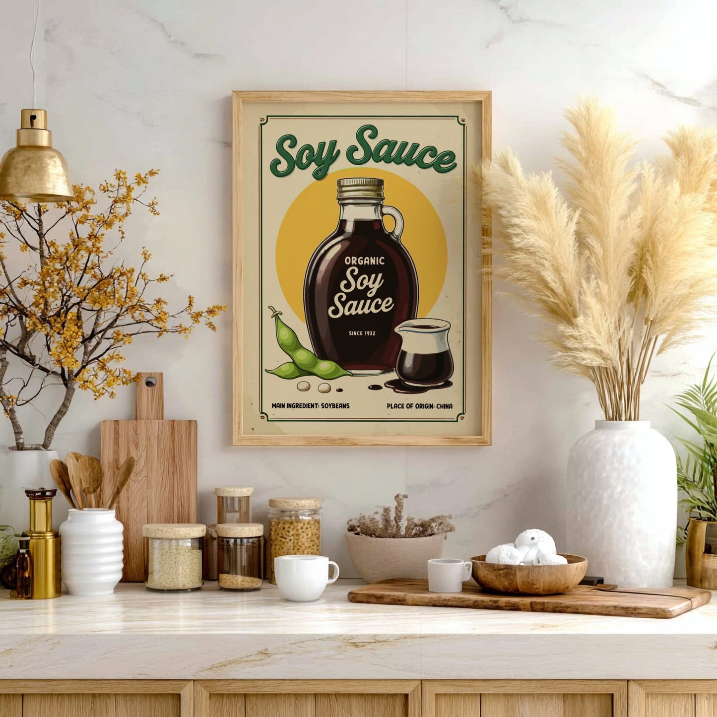 Framed soy sauce poster on a kitchen wall with various kitchen items below.