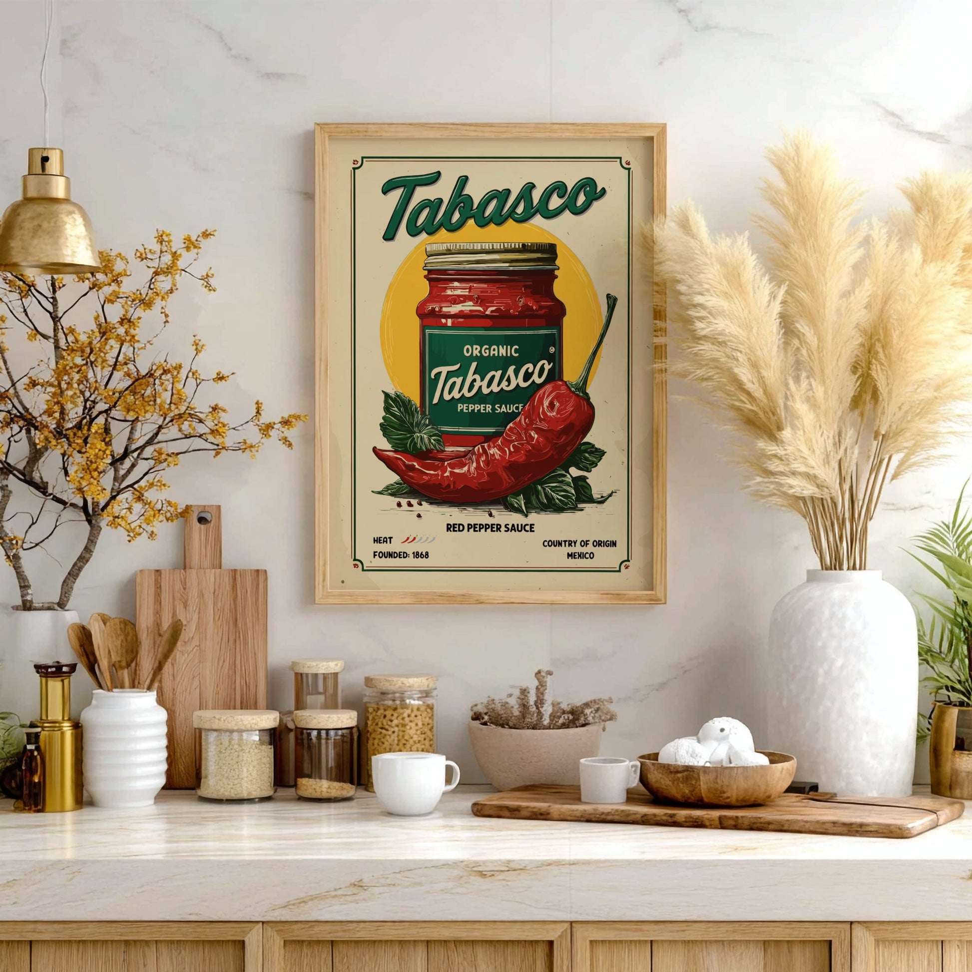 Framed Tabasco sauce poster on a kitchen wall with decorative items.