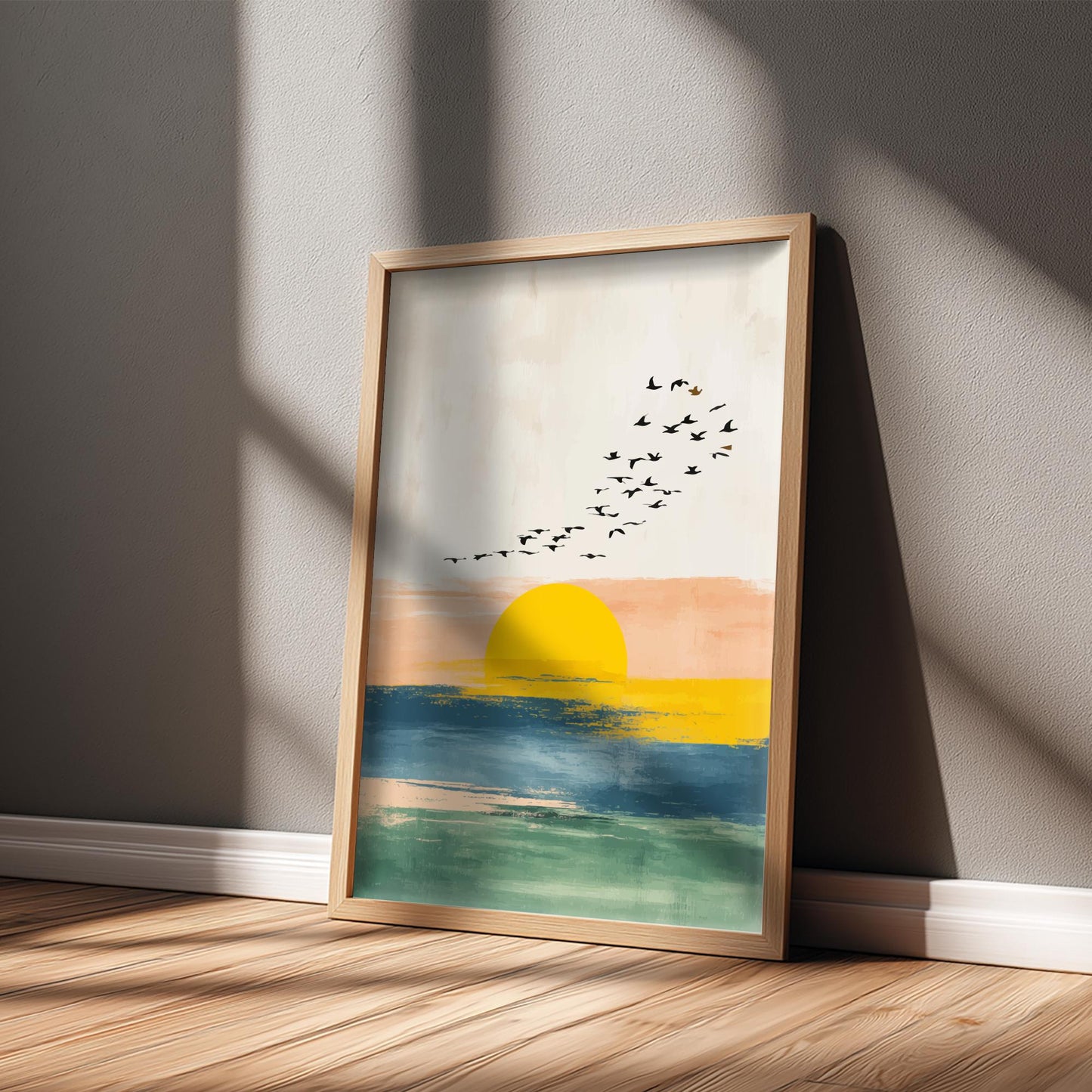 Framed artwork of a sunset scene with birds on a wall.