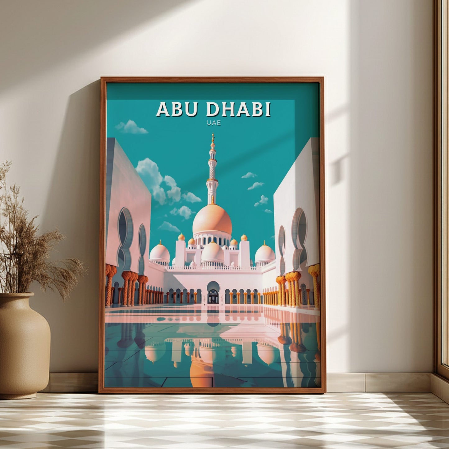 Framed poster of Abu Dhabi with a mosque on a blue background, displayed in a room.