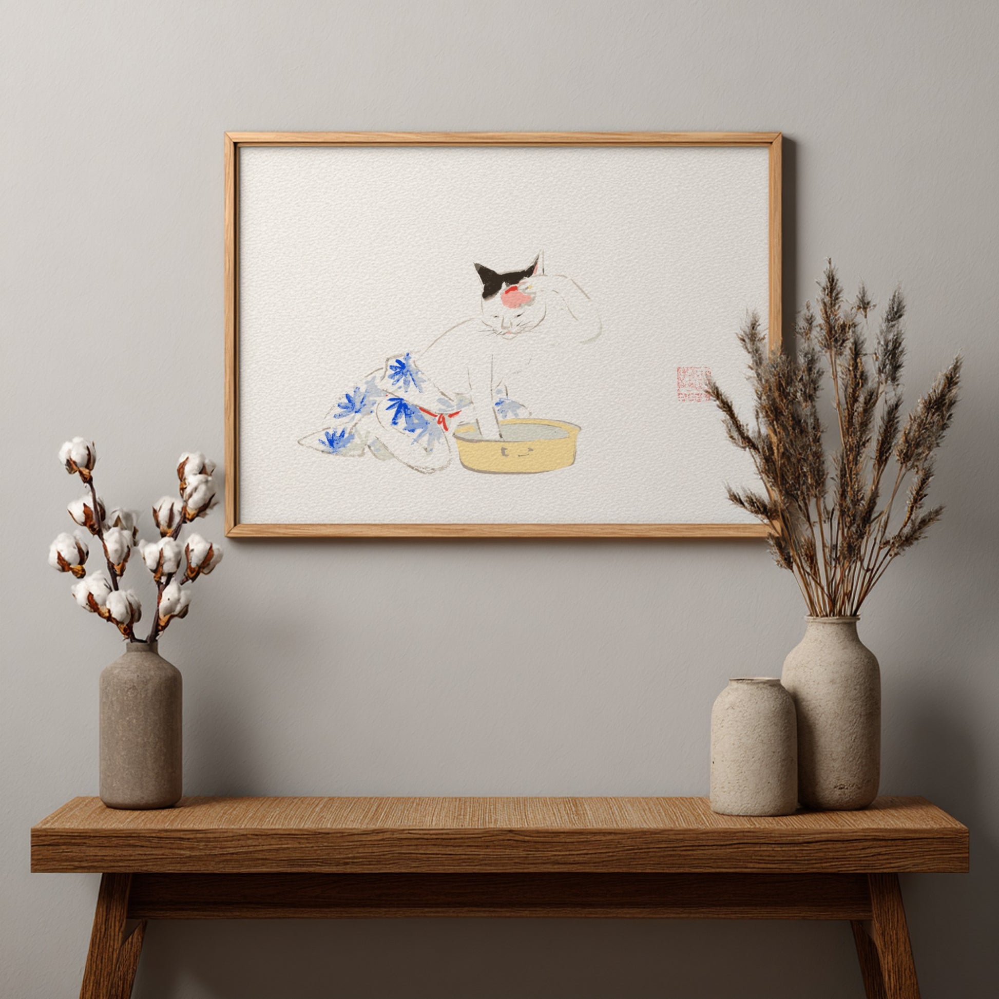 Japanese art poster featuring a playful cat illustration with floral patterns in soft colors.