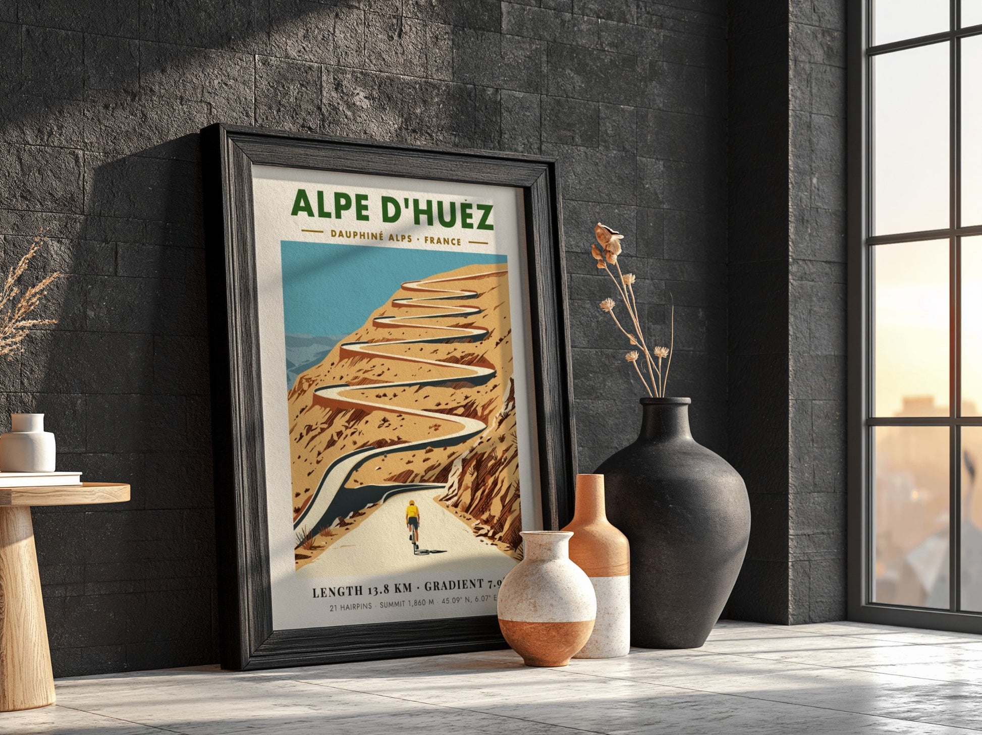 Poster featuring a lone cyclist climbing the winding Alpe D'Huez road in France.