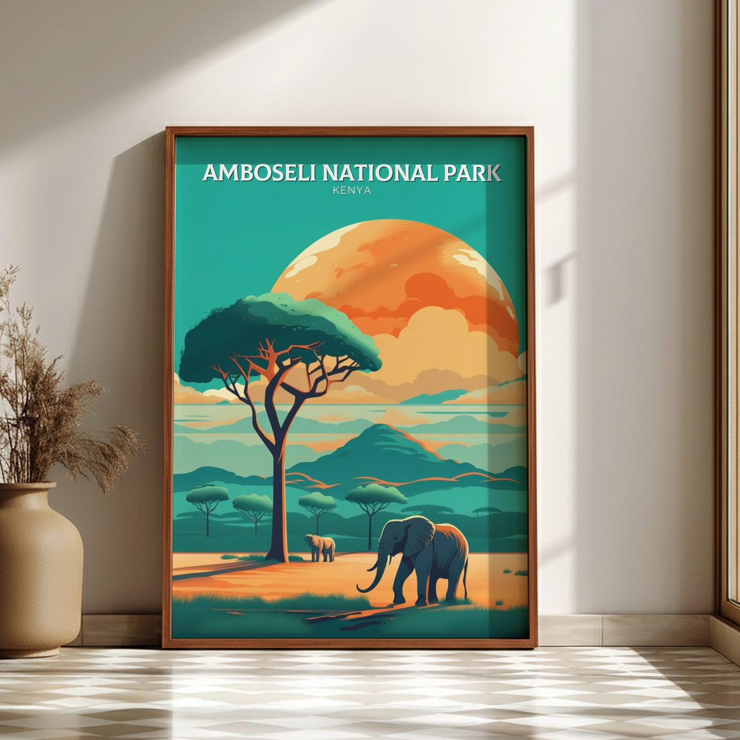 Framed poster of Amboseli National Park with an elephant and tree, on a wall.
