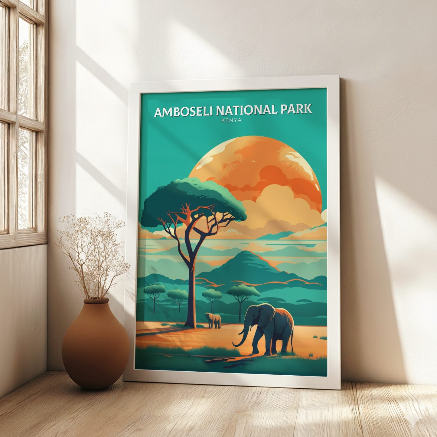 Framed poster of Amboseli National Park with an elephant and tree in a room with a vase.