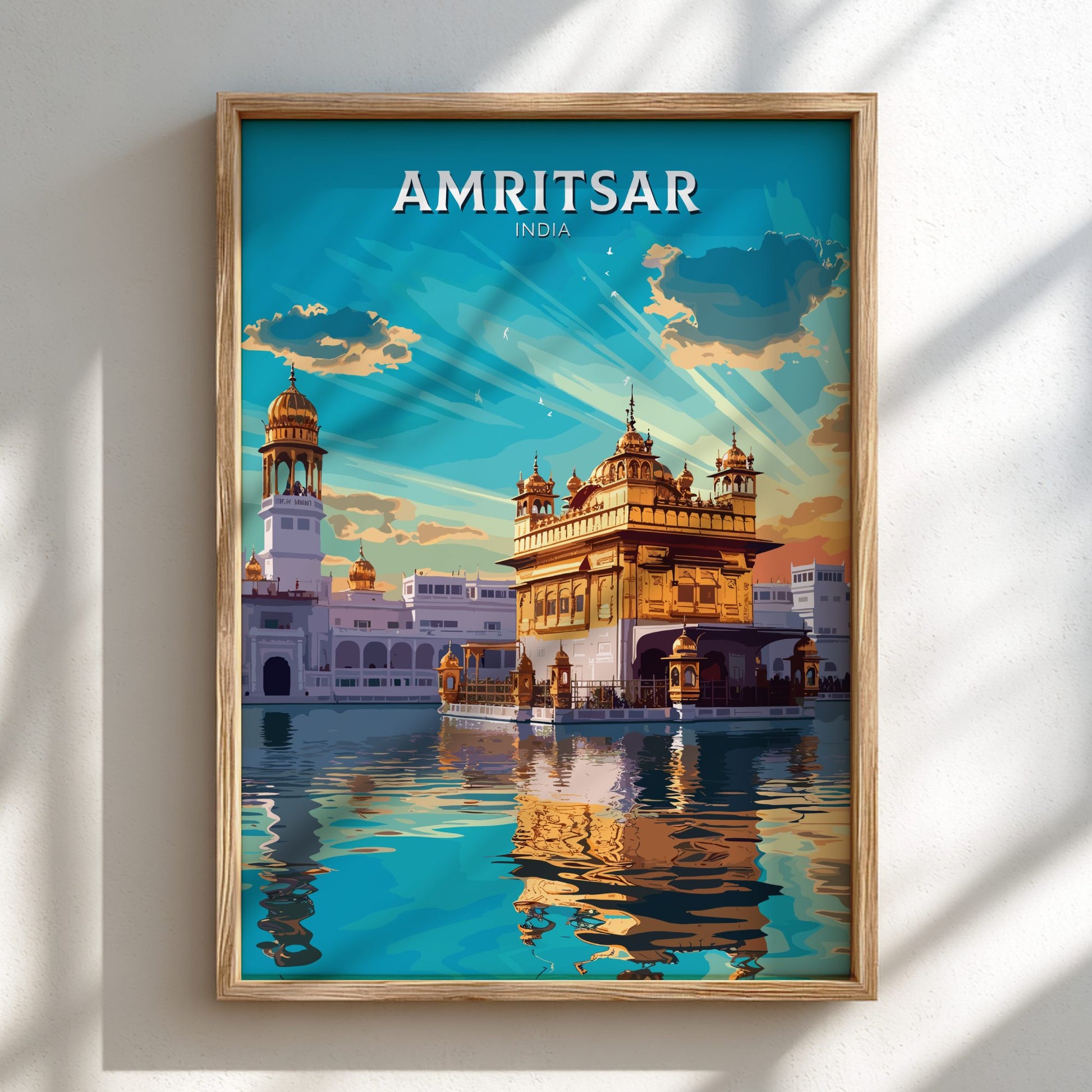 Framed poster of Amritsar with a temple and blue sky.