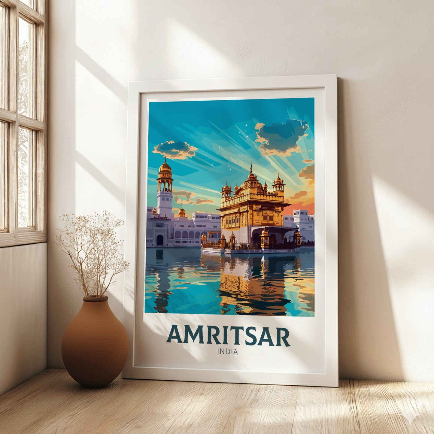 Framed poster of Amritsar, India with a temple design on a wall.