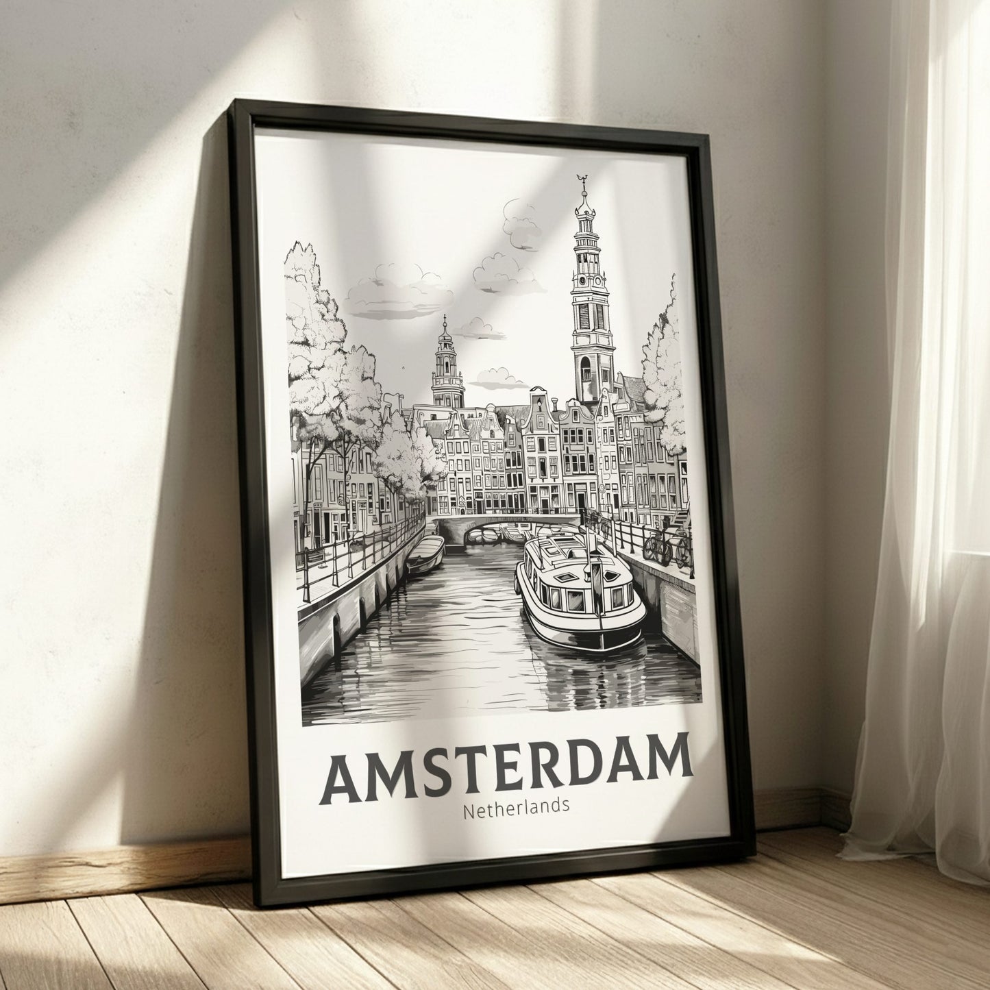 Framed poster of Amsterdam with a canal scene and 'Amsterdam Netherlands' text.