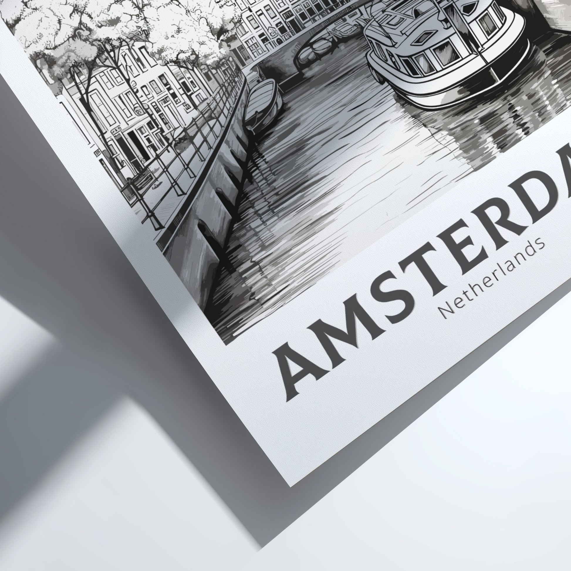 Framed black and white illustration of Amsterdam with a canal scene.