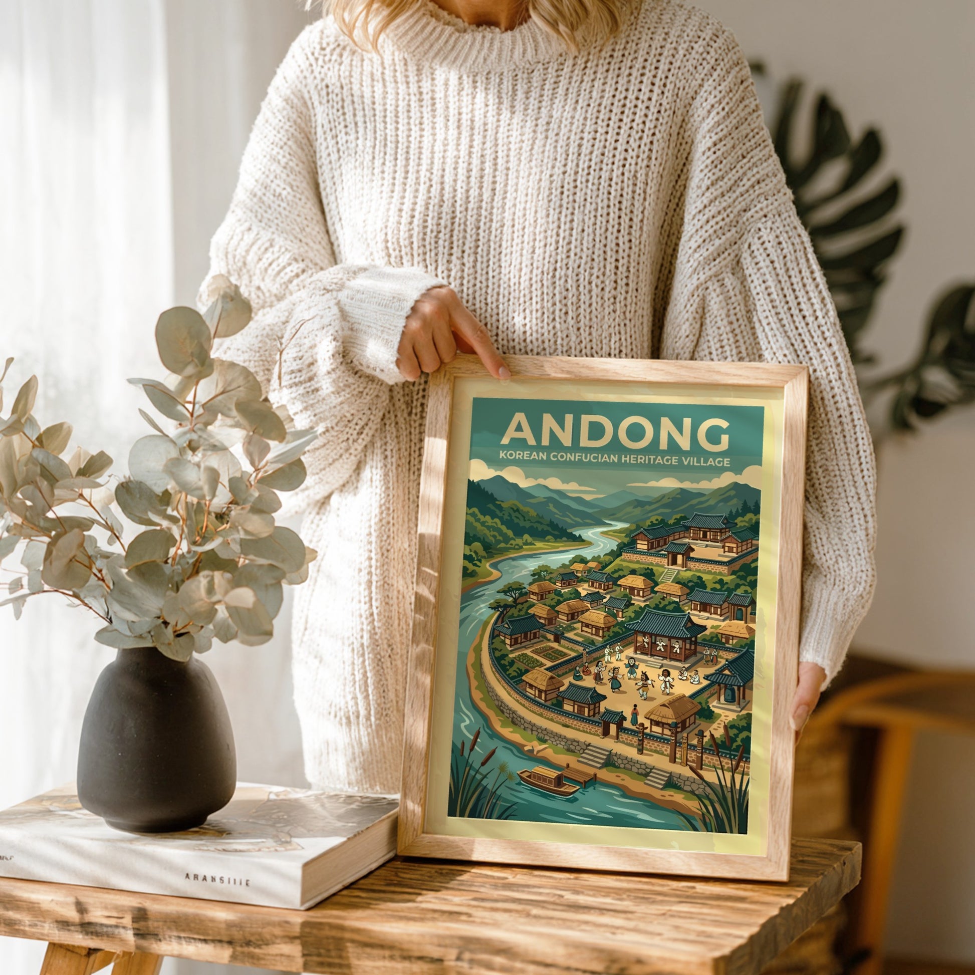 Travel poster of Andong Korean Heritage Village featuring traditional architecture mountains and river.