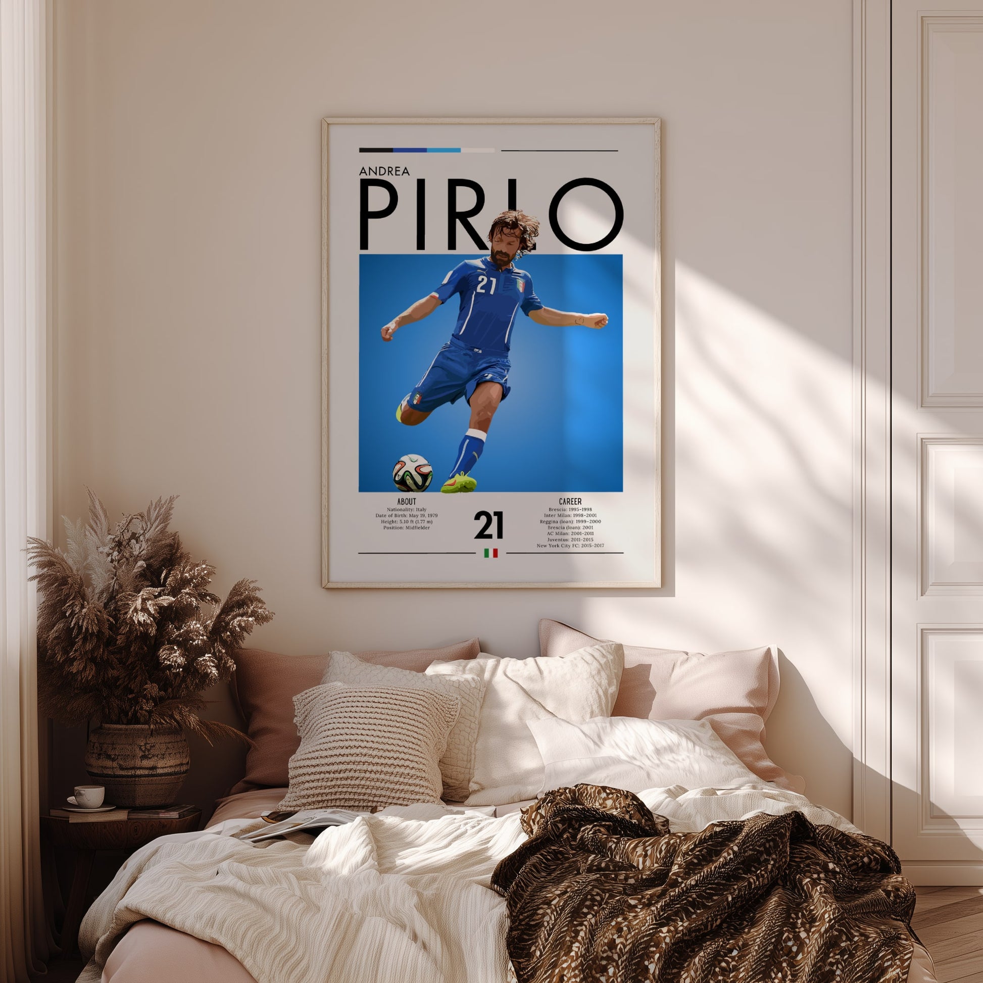 Framed poster of Andrea Pirlo above a bed in a bedroom
