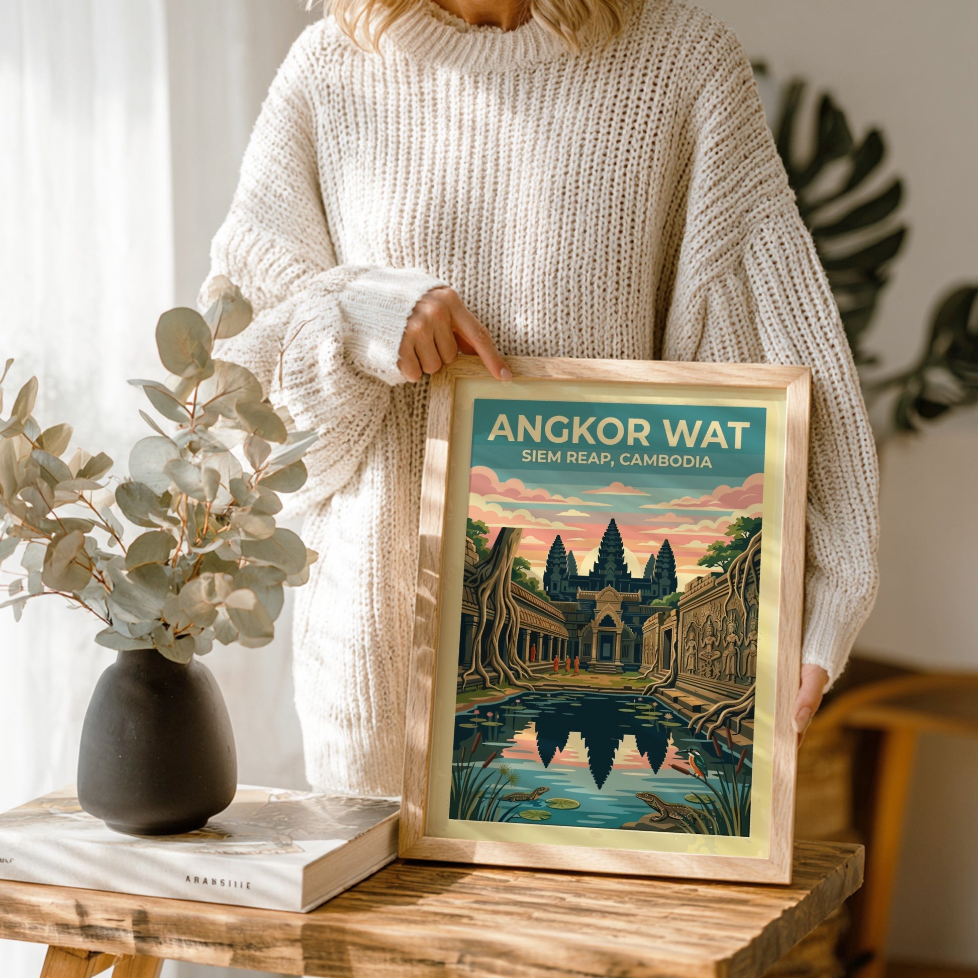 Travel poster of Angkor Wat in Siem Reap with temple reflections and wildlife.