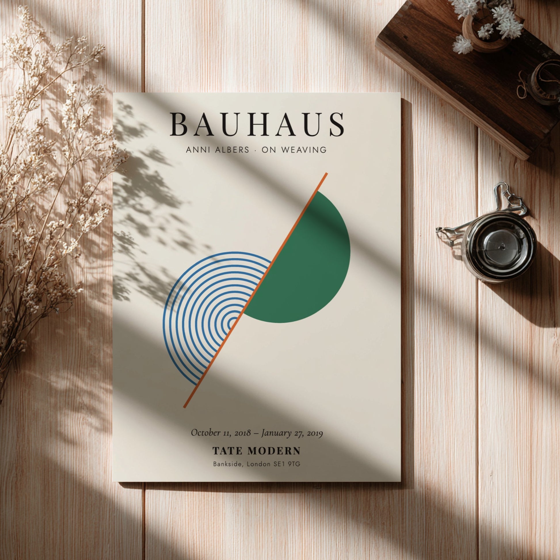 Bauhaus poster featuring Anni Albers' weaving art with geometric shapes and soothing colors.