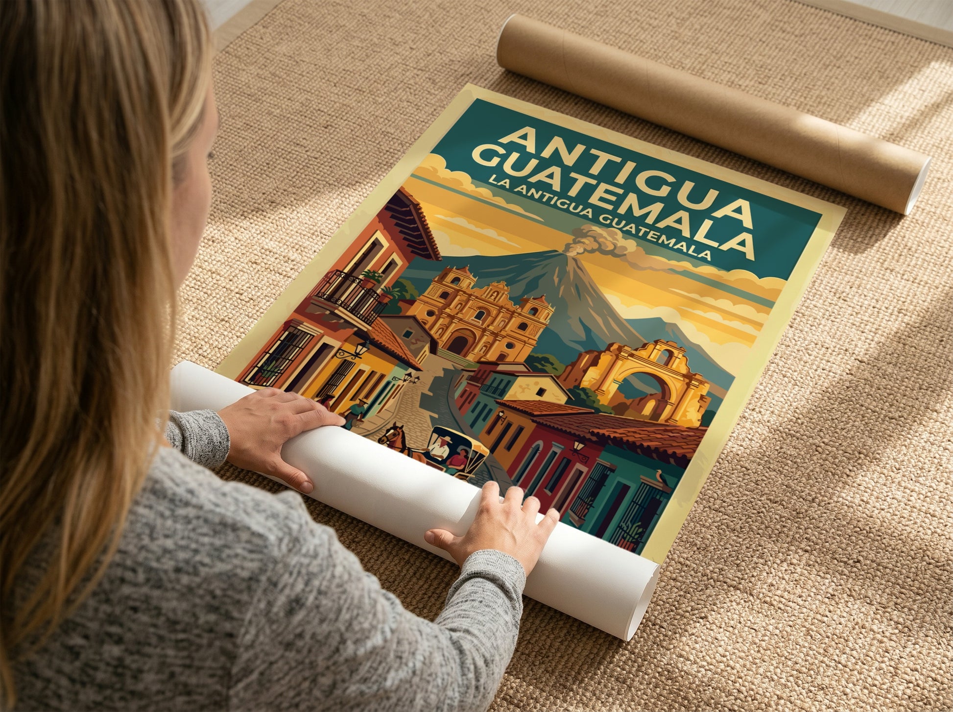 Travel poster of Antigua Guatemala showing a cobblestone street, cathedral, and distant volcano.