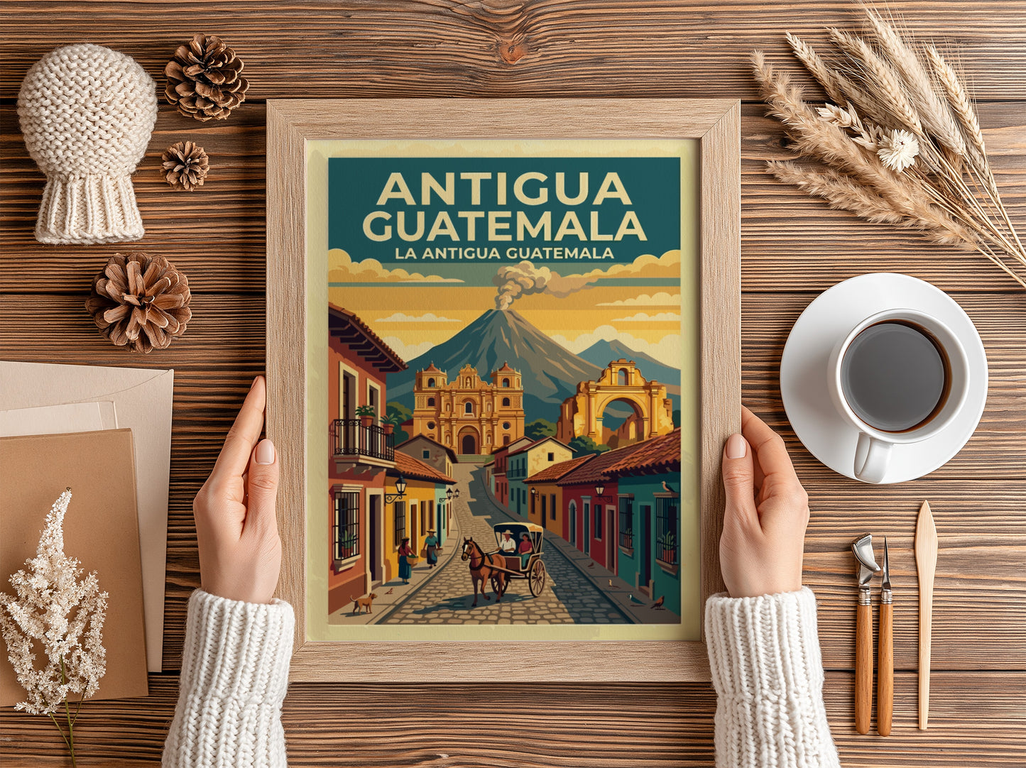 Travel poster of Antigua Guatemala showing a cobblestone street, cathedral, and distant volcano.