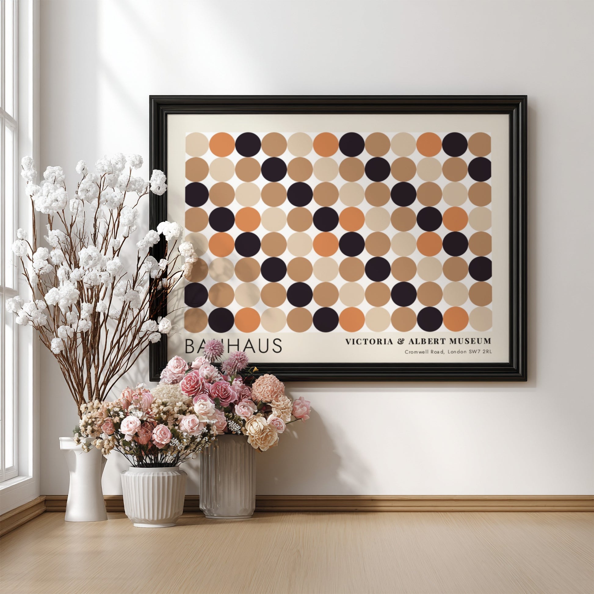 Wall art poster featuring a geometric Bauhaus grid of tan, orange, and black circles.