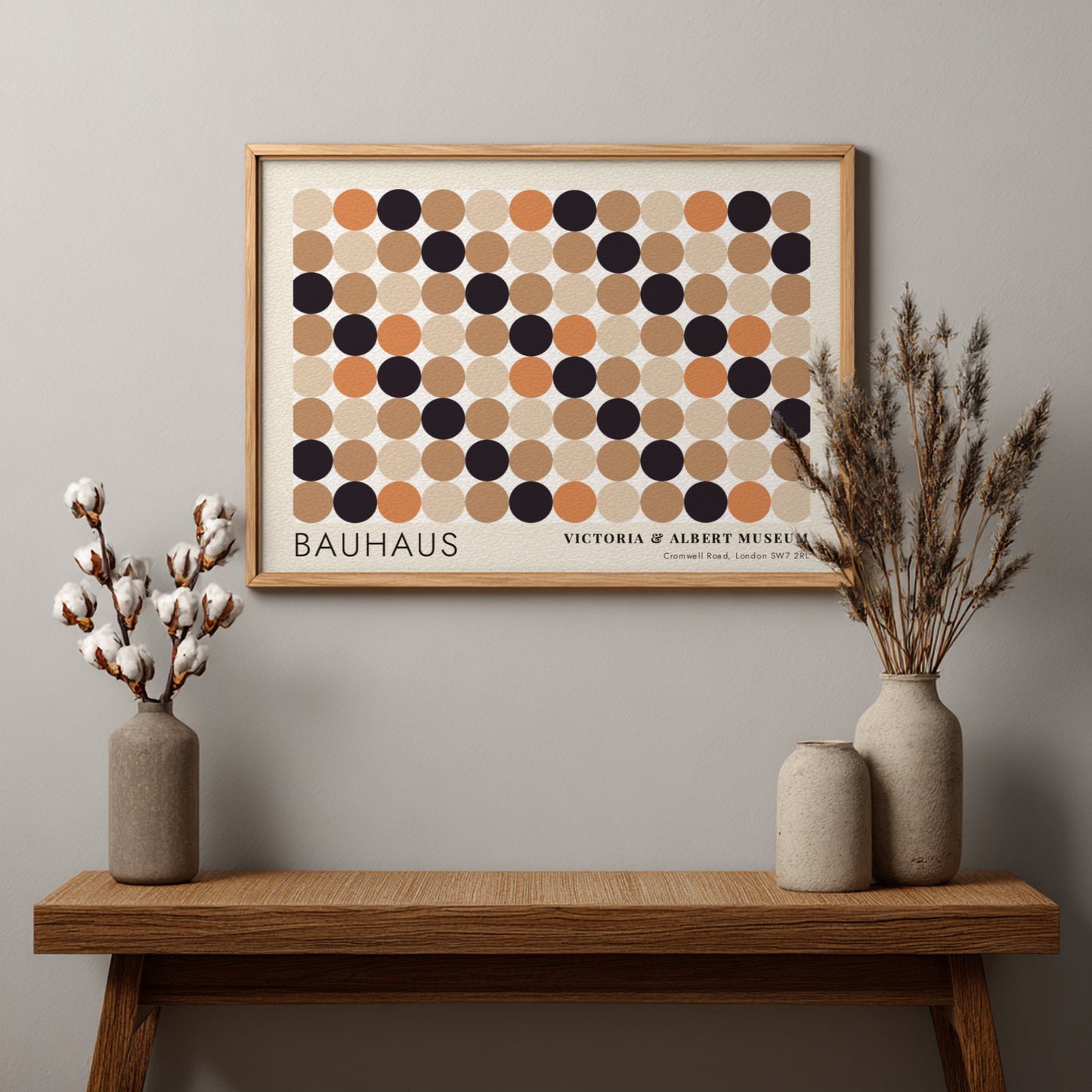 Wall art poster featuring a geometric Bauhaus grid of tan, orange, and black circles.