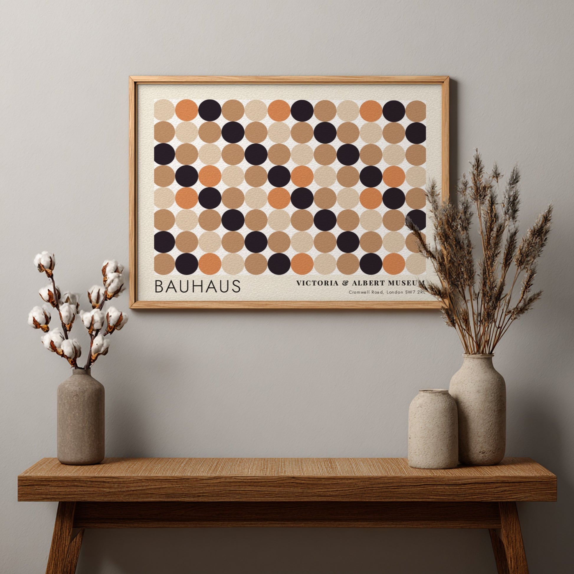 Wall art poster featuring a geometric Bauhaus grid of tan, orange, and black circles.
