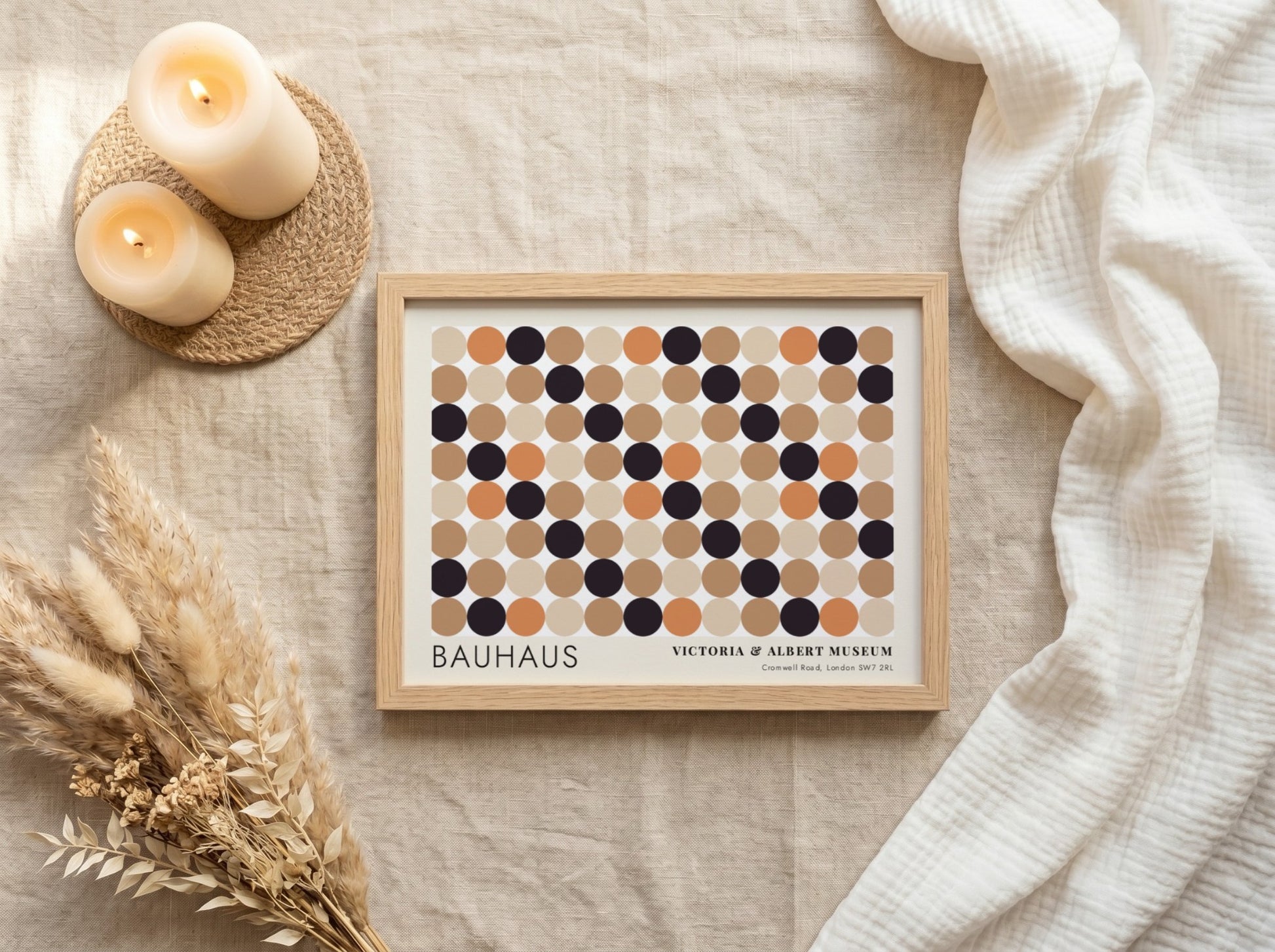 Wall art poster featuring a geometric Bauhaus grid of tan, orange, and black circles.