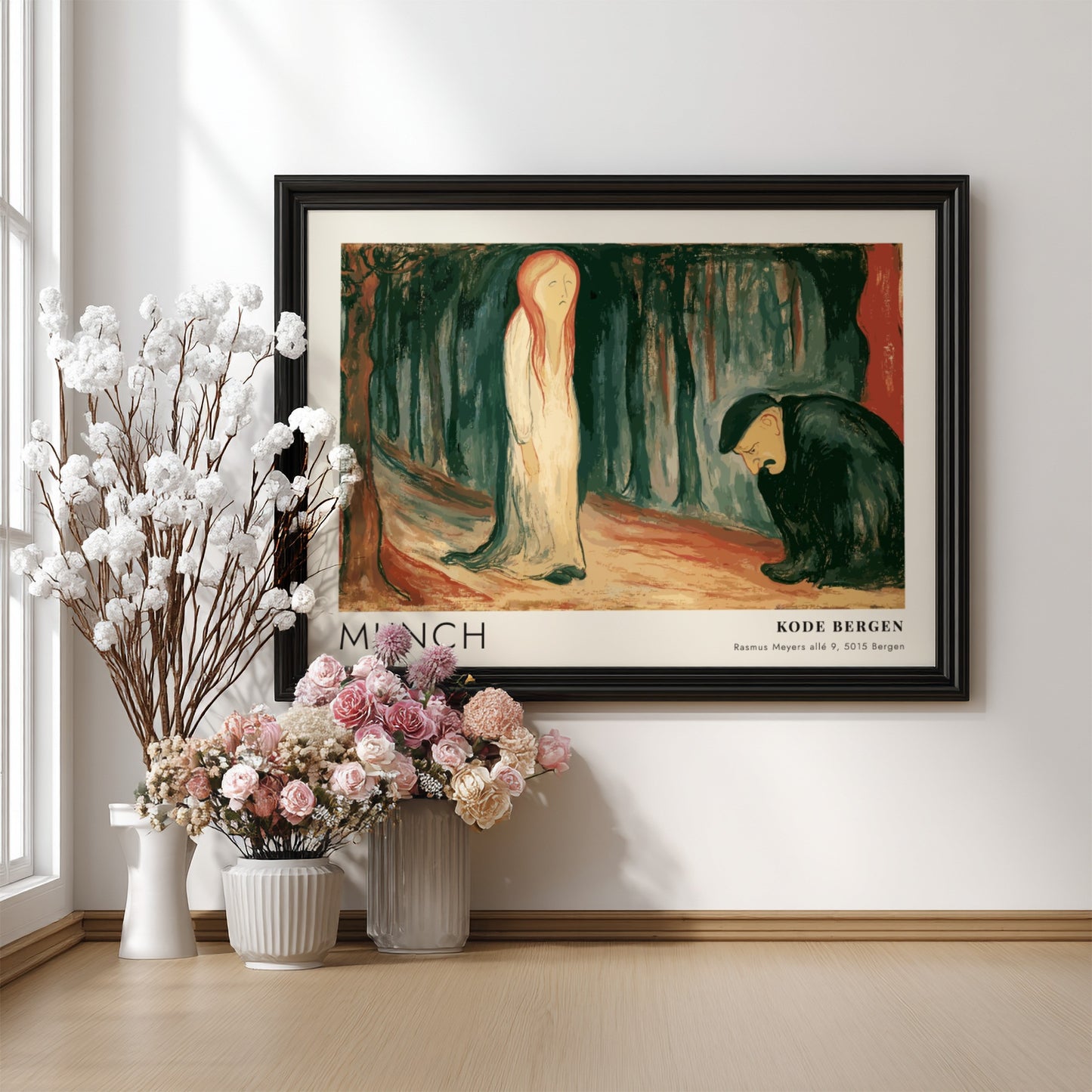 Exhibition poster featuring Edvard Munch's Ashes painting in a light wooden frame hanging