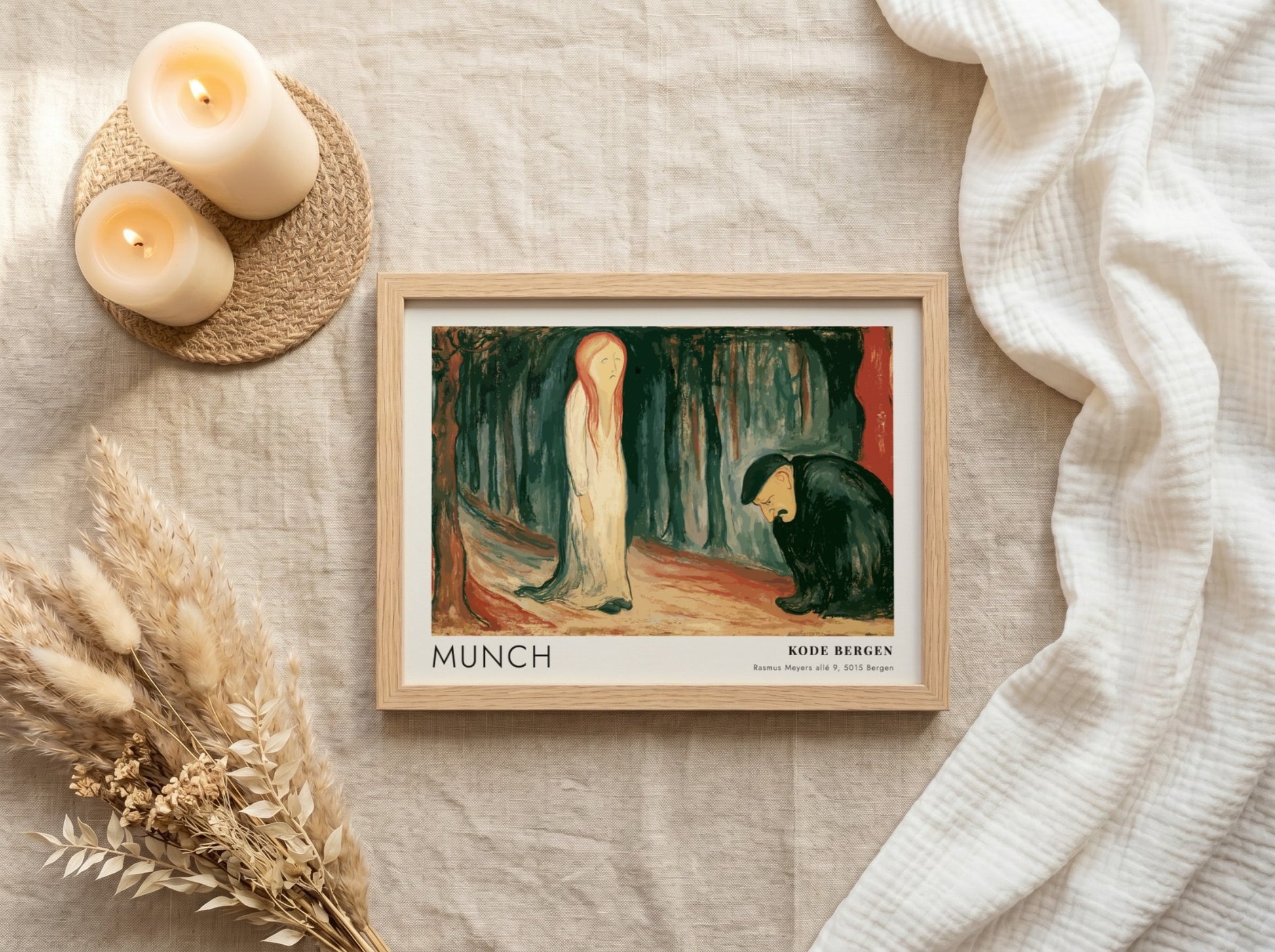Exhibition poster featuring Edvard Munch's Ashes painting in a light wooden frame hanging