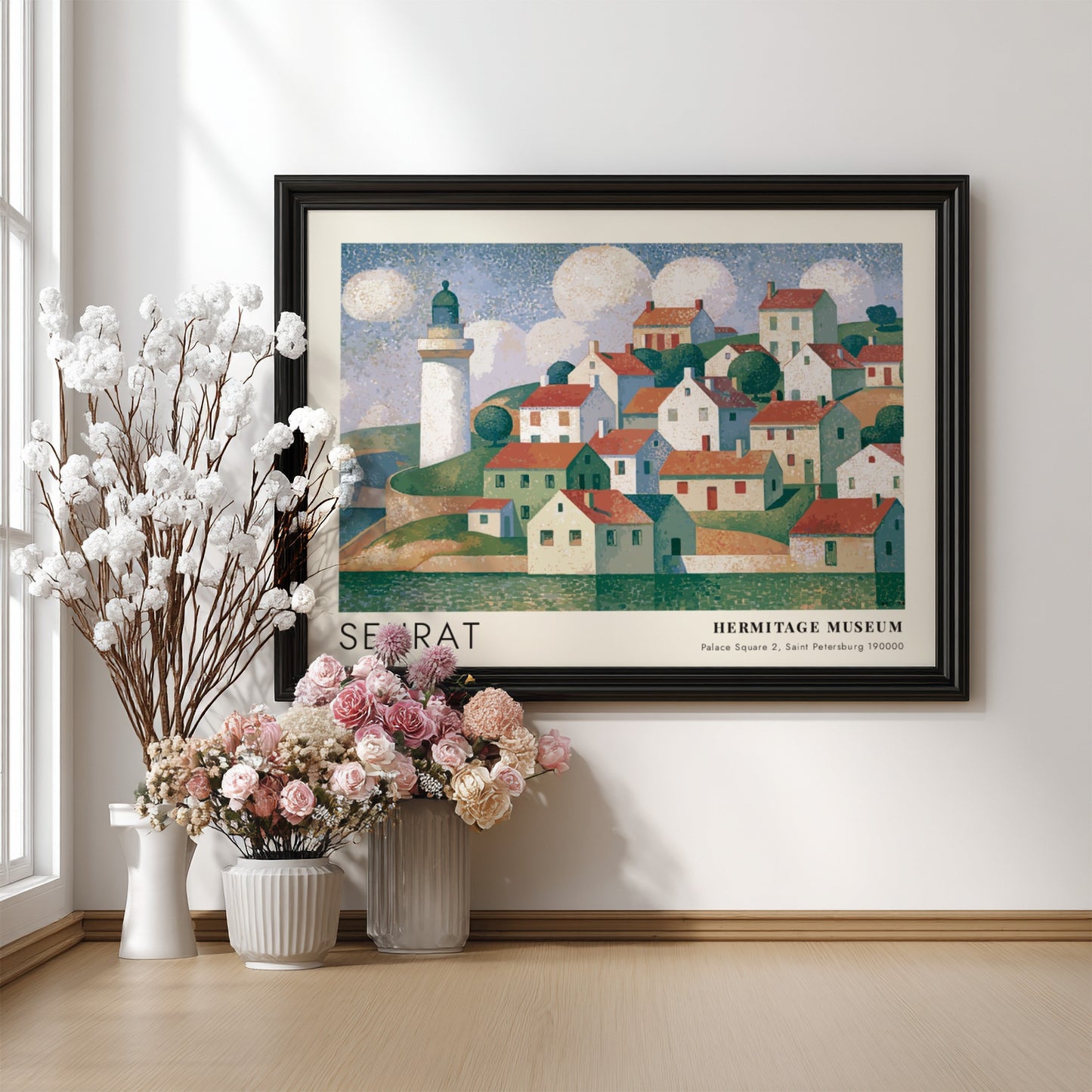 Wall art poster featuring a Seurat coastal village scene with a lighthouse and clouds.