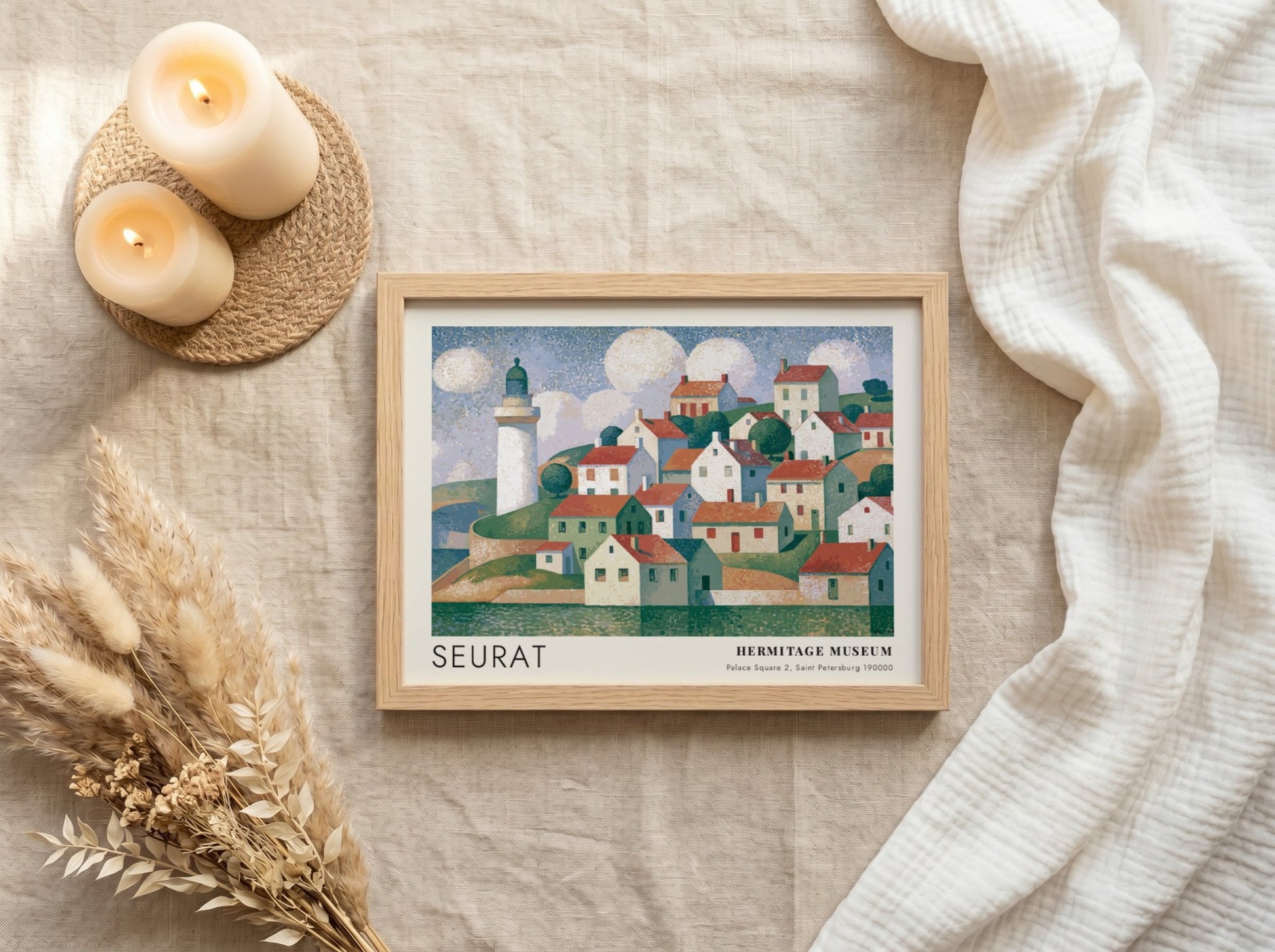 Wall art poster featuring a Seurat coastal village scene with a lighthouse and clouds.