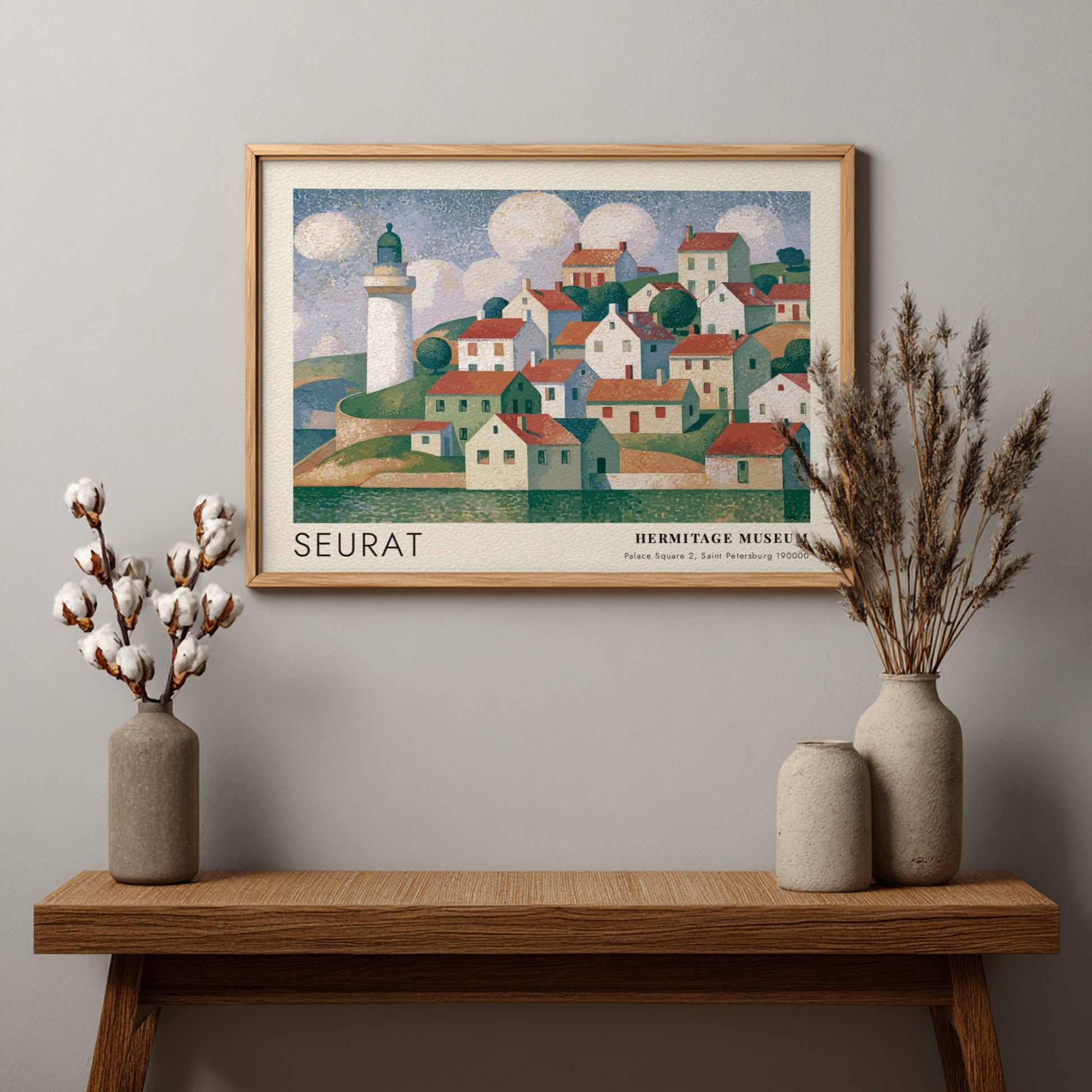 Wall art poster featuring a Seurat coastal village scene with a lighthouse and clouds.