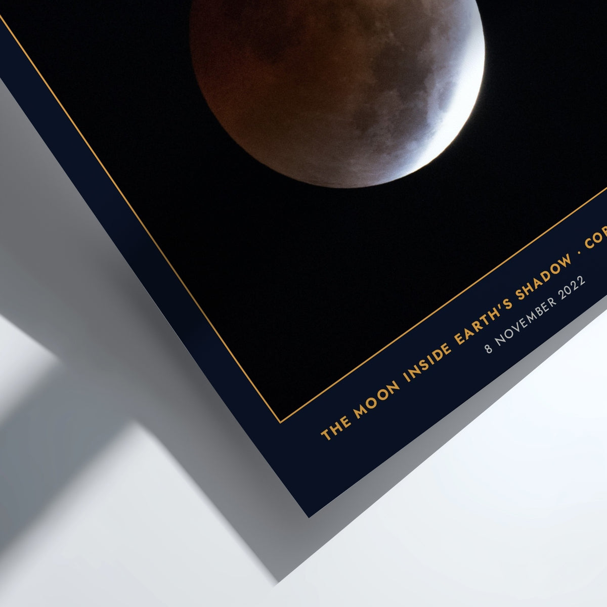 Blood Moon poster showing a copper-red lunar eclipse against a deep navy background