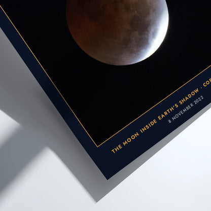 Blood Moon poster showing a copper-red lunar eclipse against a deep navy background