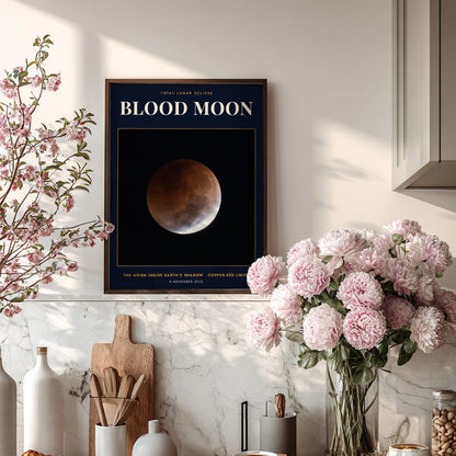 Blood Moon poster showing a copper-red lunar eclipse against a deep navy background