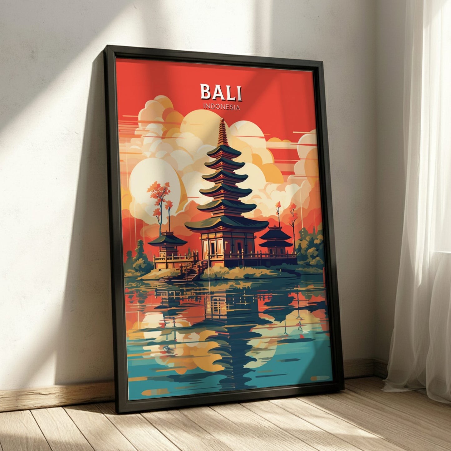 Framed poster of Bali with a temple and lake scene on a red background.