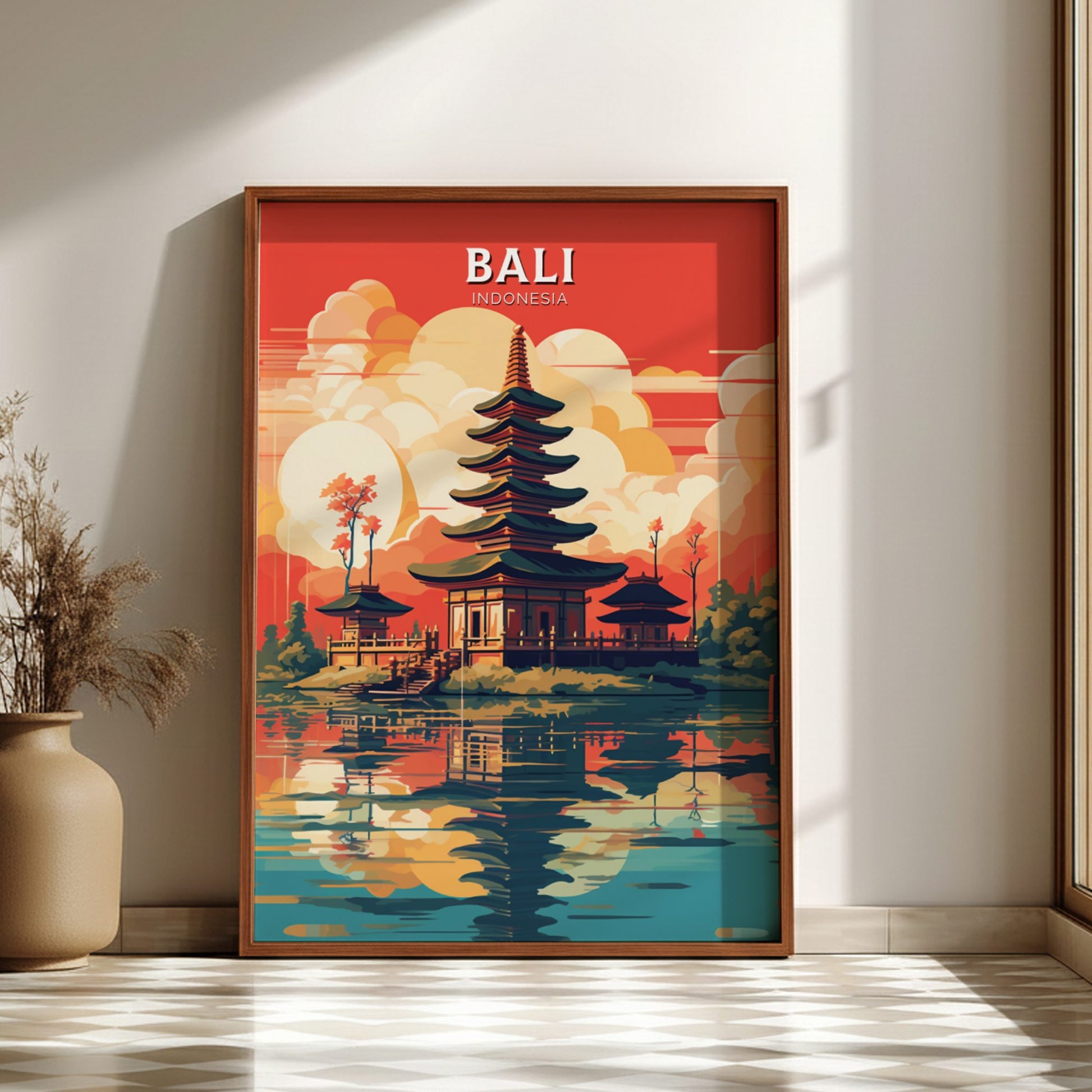 Framed artwork of a temple in Bali with a red background, displayed on a wall.