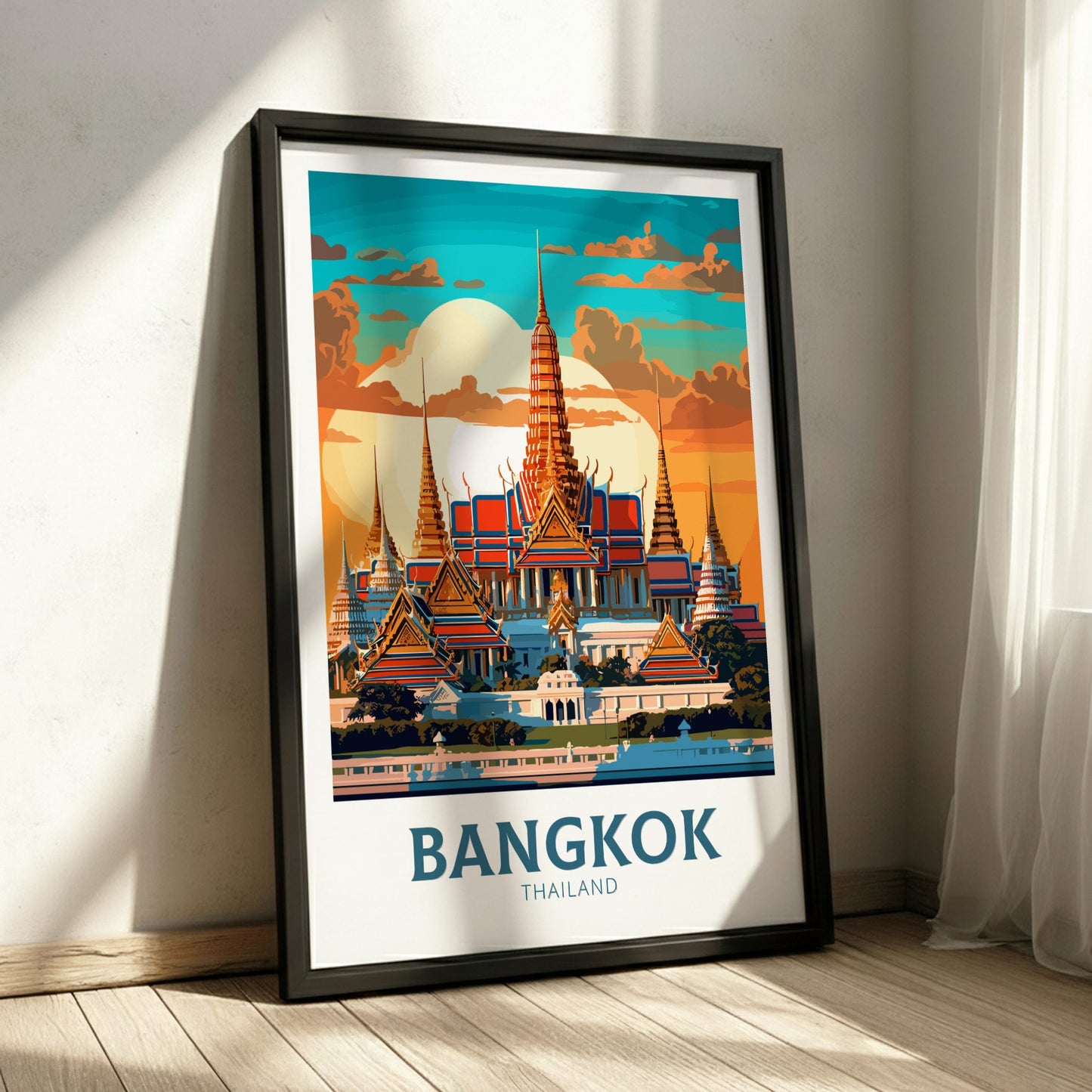 Framed poster of Bangkok, Thailand with a temple design on a white wall.