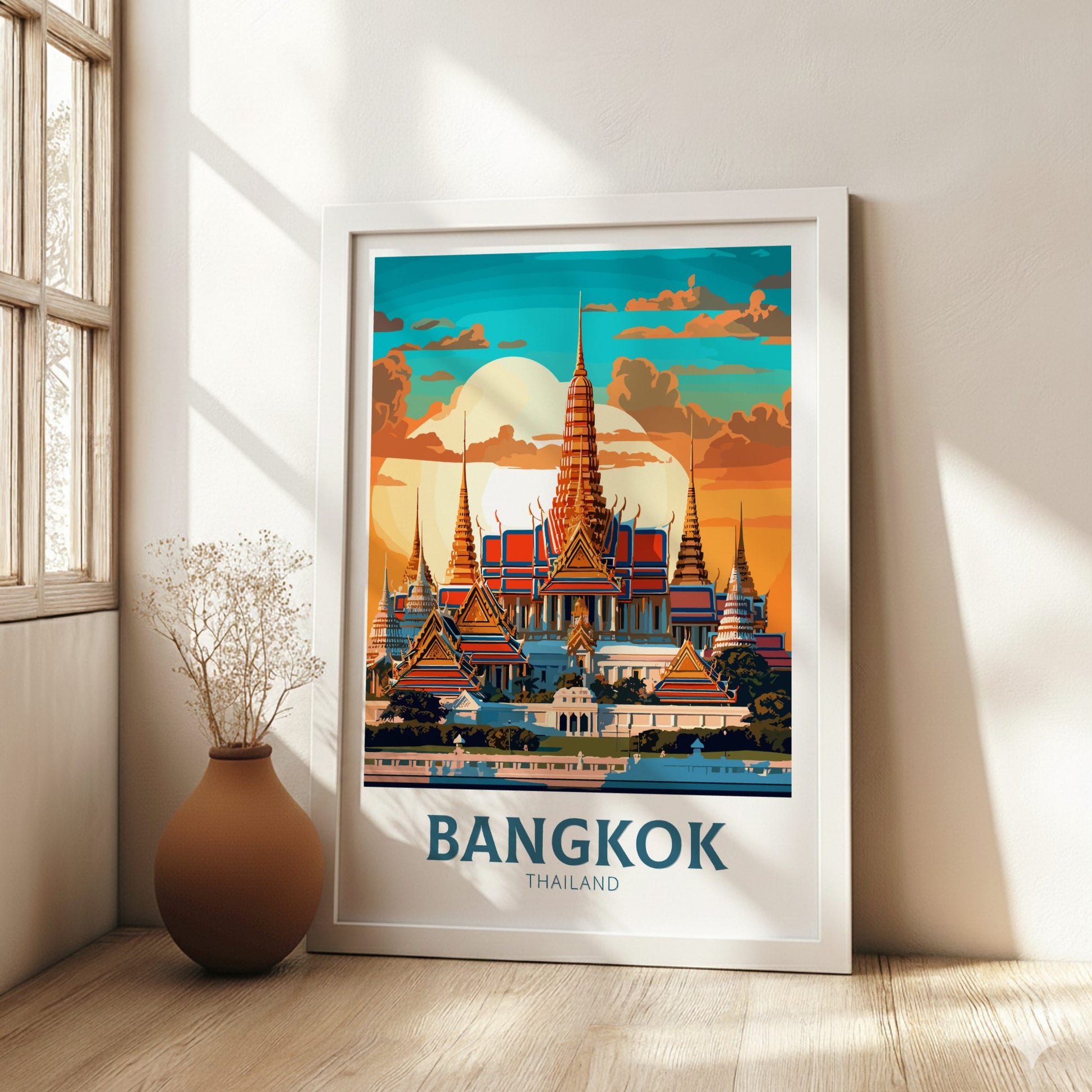 Framed poster of Bangkok, Thailand in a room with a vase and plant.