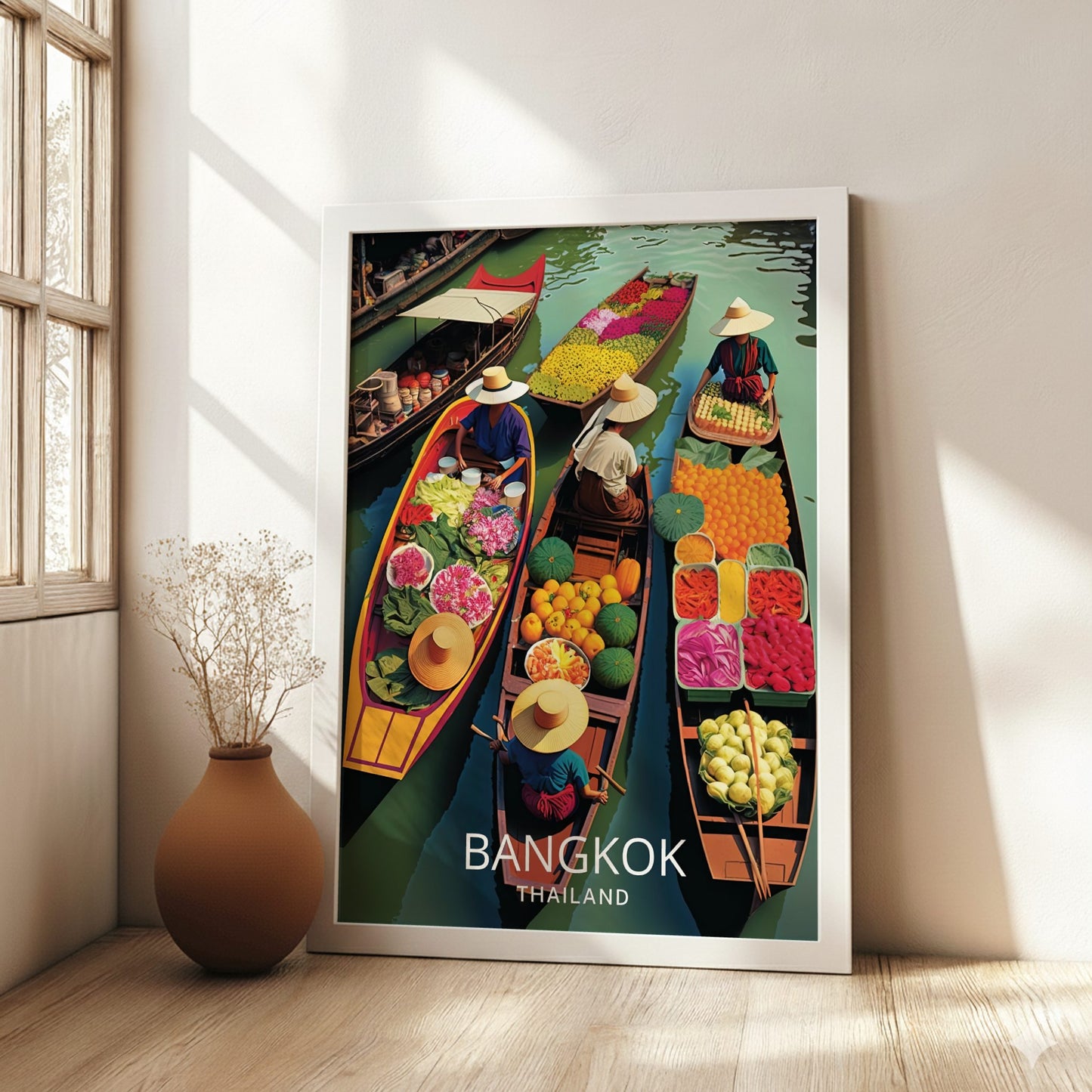 Framed poster of Bangkok, Thailand with colorful boats and floating market scene on a wall.