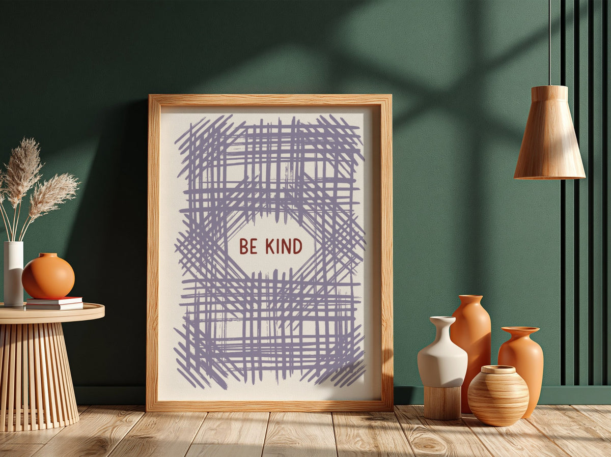 Motivational poster with Be Kind text centered over a soft lavender crosshatch pattern.